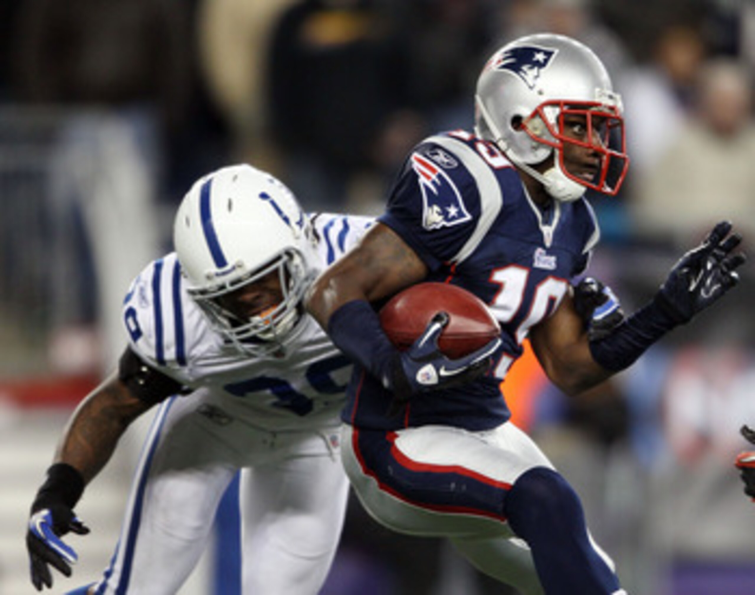 FOXBORO, MA - NOVEMBER 21:   Brandon Tate #19 of the New England Patriots carries the ball as Cornelius Brown #39 of the Indianapolis Colts defends on November 21, 2010 at Gillette Stadium in Foxboro, Massachusetts. (Photo by Elsa/Getty Images)