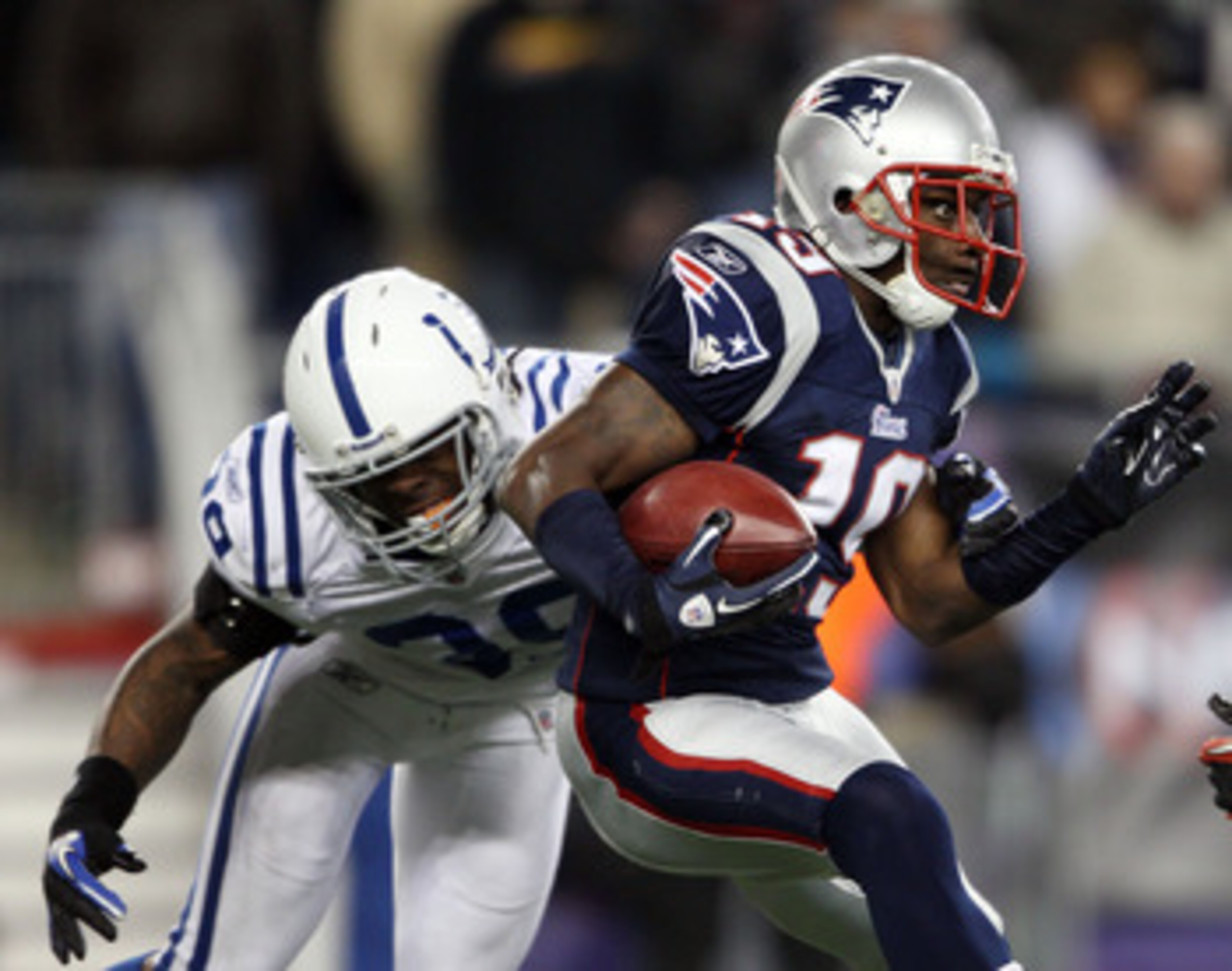 FOXBORO, MA - NOVEMBER 21:   Brandon Tate #19 of the New England Patriots carries the ball as Cornelius Brown #39 of the Indianapolis Colts defends on November 21, 2010 at Gillette Stadium in Foxboro, Massachusetts. (Photo by Elsa/Getty Images)