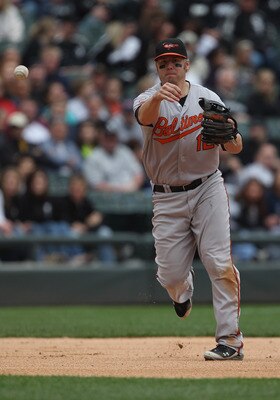 CHICAGO, IL - MAY 01: Mark Reynolds #12 of the Baltimore Orioles throws out a Chicago White Sox runner at U.S. Cellular Field on May 1, 2011 in Chicago, Illinois. The Orioles defeated the White Sox 6-4. (Photo by Jonathan Daniel/Getty Images)