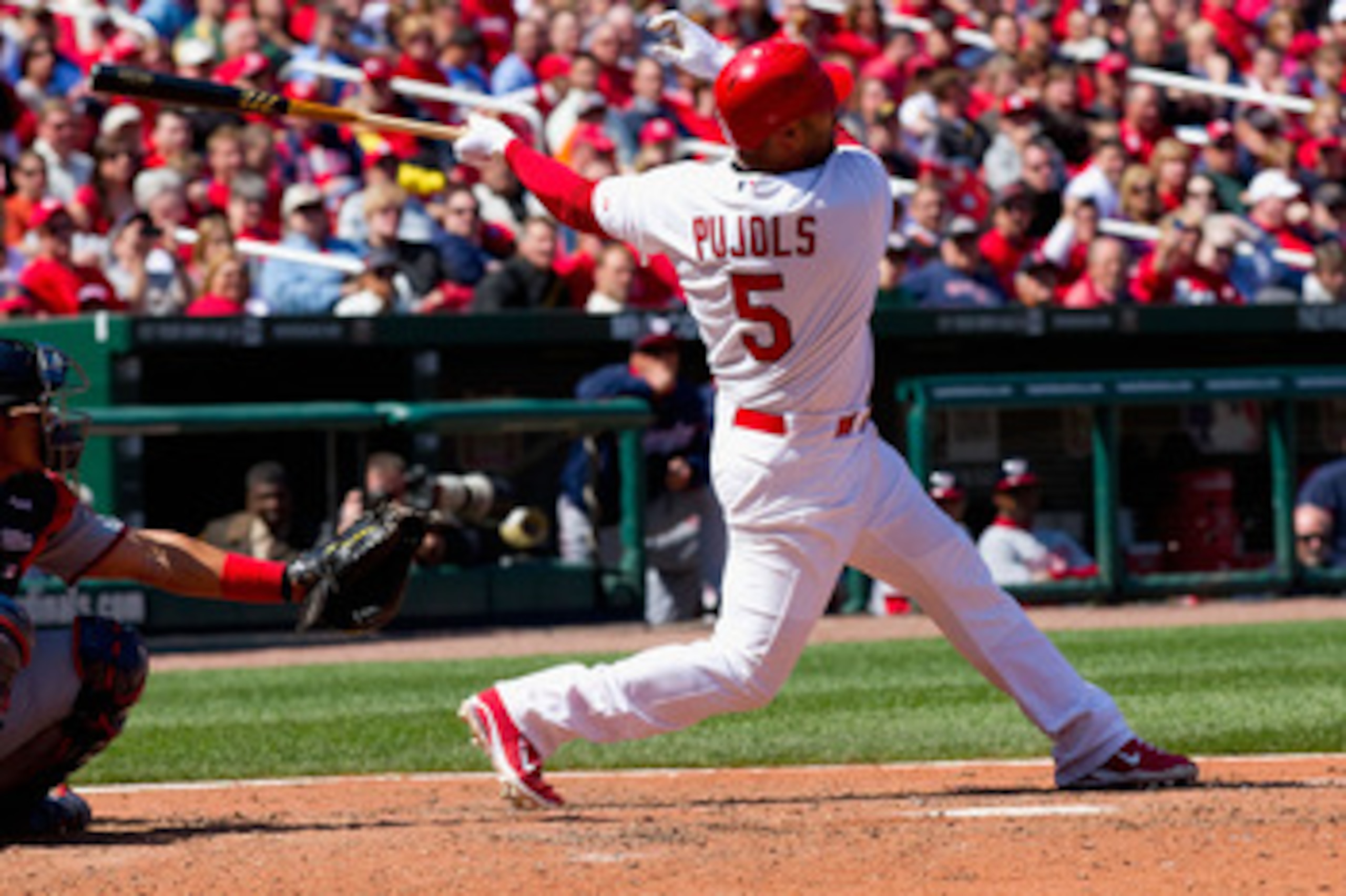 ST. LOUIS, MO - APRIL 21: Albert Pujols #5 of the St. Louis Cardinals hits a two-run home run against the Washington Nationals at Busch Stadium on April 21, 2011 in St. Louis, Missouri.  (Photo by Dilip Vishwanat/Getty Images)