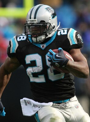 CHARLOTTE, NC - DECEMBER 06:  Jonathan Stewart #28 of the Carolina Panthers runs with the ball against the Tampa Bay Buccaneers during their game at Bank of America Stadium on December 6, 2009 in Charlotte, North Carolina.  (Photo by Streeter Lecka/Getty