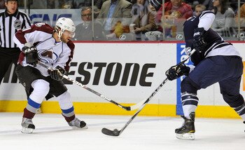 NASHVILLE, TN - FEBRUARY 12:  Peter Forsberg #21 of the Colorado Avalanche skates against Shea Weber #6 of the Nashville Predators on February 12, 2011 at the Bridgestone Arena in Nashville, Tennessee.  (Photo by Frederick Breedon/Getty Images)