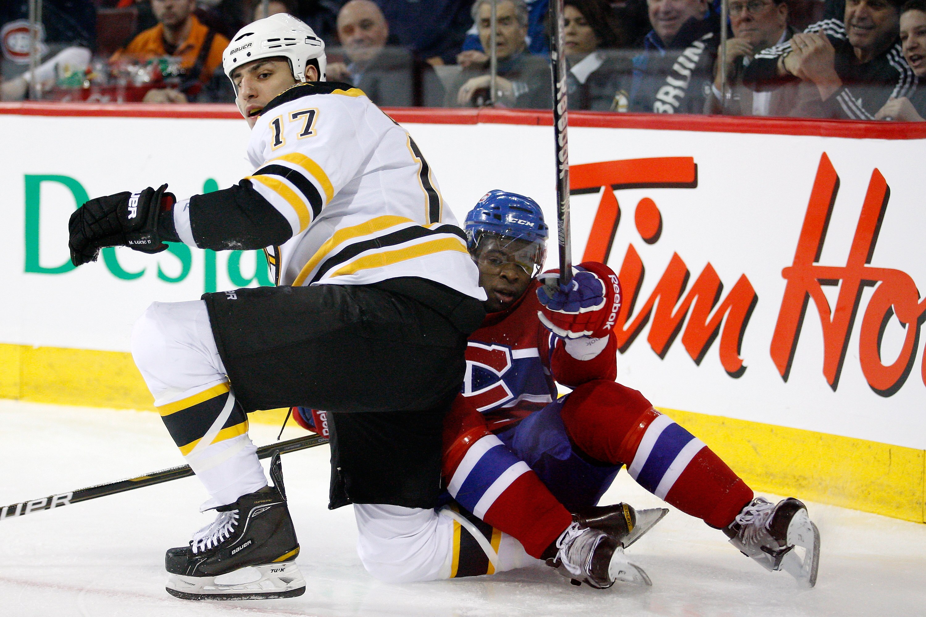 MONTREAL, CANADA - MARCH 8:  Milan Lucic #17 of the Boston Bruins and P.K. Subban #76 of the Montreal Canadiens get up after colliding during the NHL game at the Bell Centre on March 8, 2011 in Montreal, Quebec, Canada.  The Canadiens defeated the Bruins
