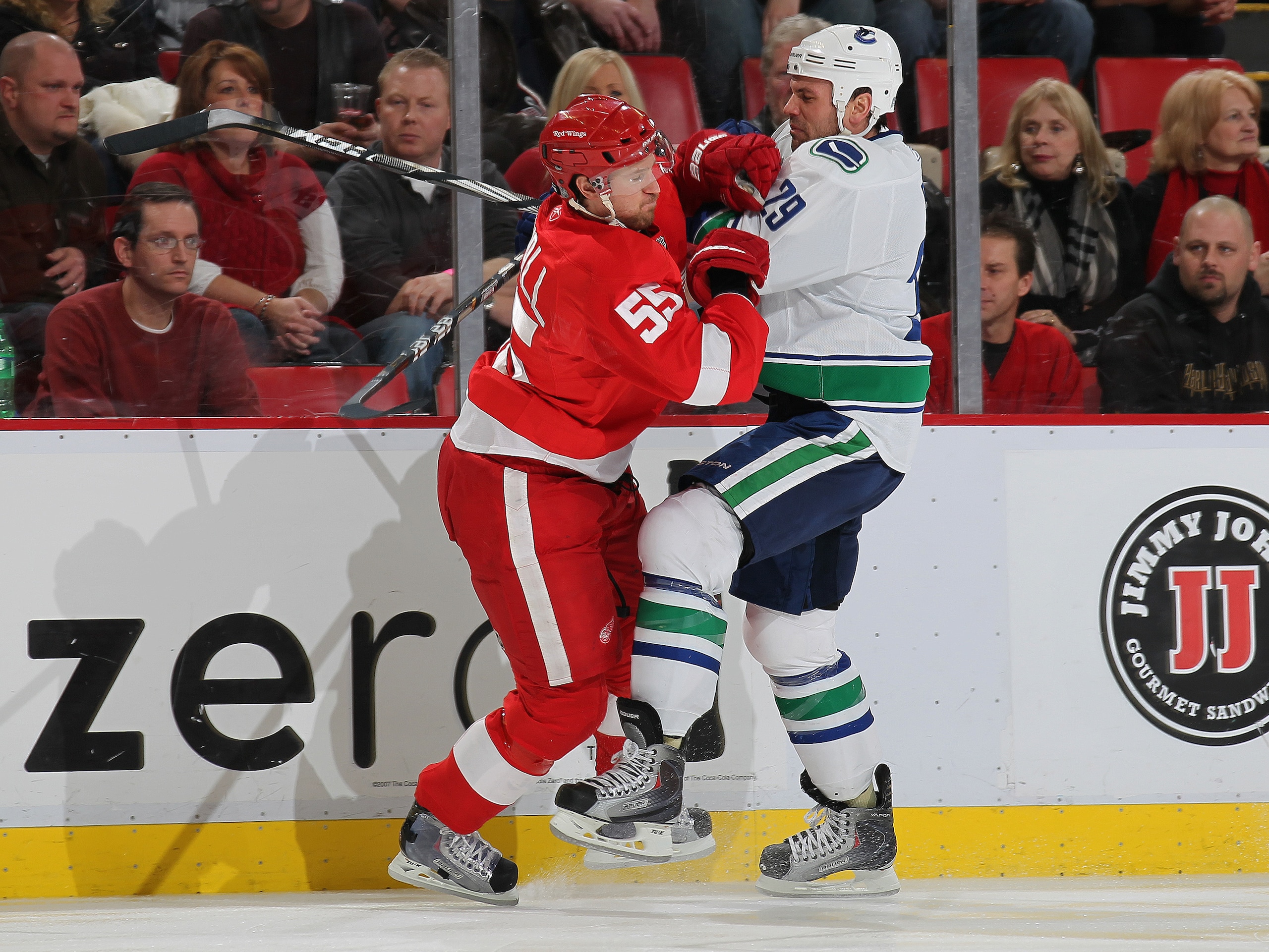 DETROIT, MI - DECEMBER 22: Aaron Rome #29 of the Vancouver Canucks is stood up on a check by Niklas Kronwall #55 of the Detroit Red Wings in a game on December 22, 2010 at the Joe Louis Arena in Detroit, Michigan. (Photo by Claus Andersen/Getty Images) DETROIT, MI - DECEMBER 22: Aaron Rome #29 of the Vancouver Canucks is stood up on a check by Niklas Kronwall #55 of the Detroit Red Wings in a game on December 22, 2010 at the Joe Louis Arena in Detroit, Michigan. (Photo by Claus Andersen/Getty Images)
