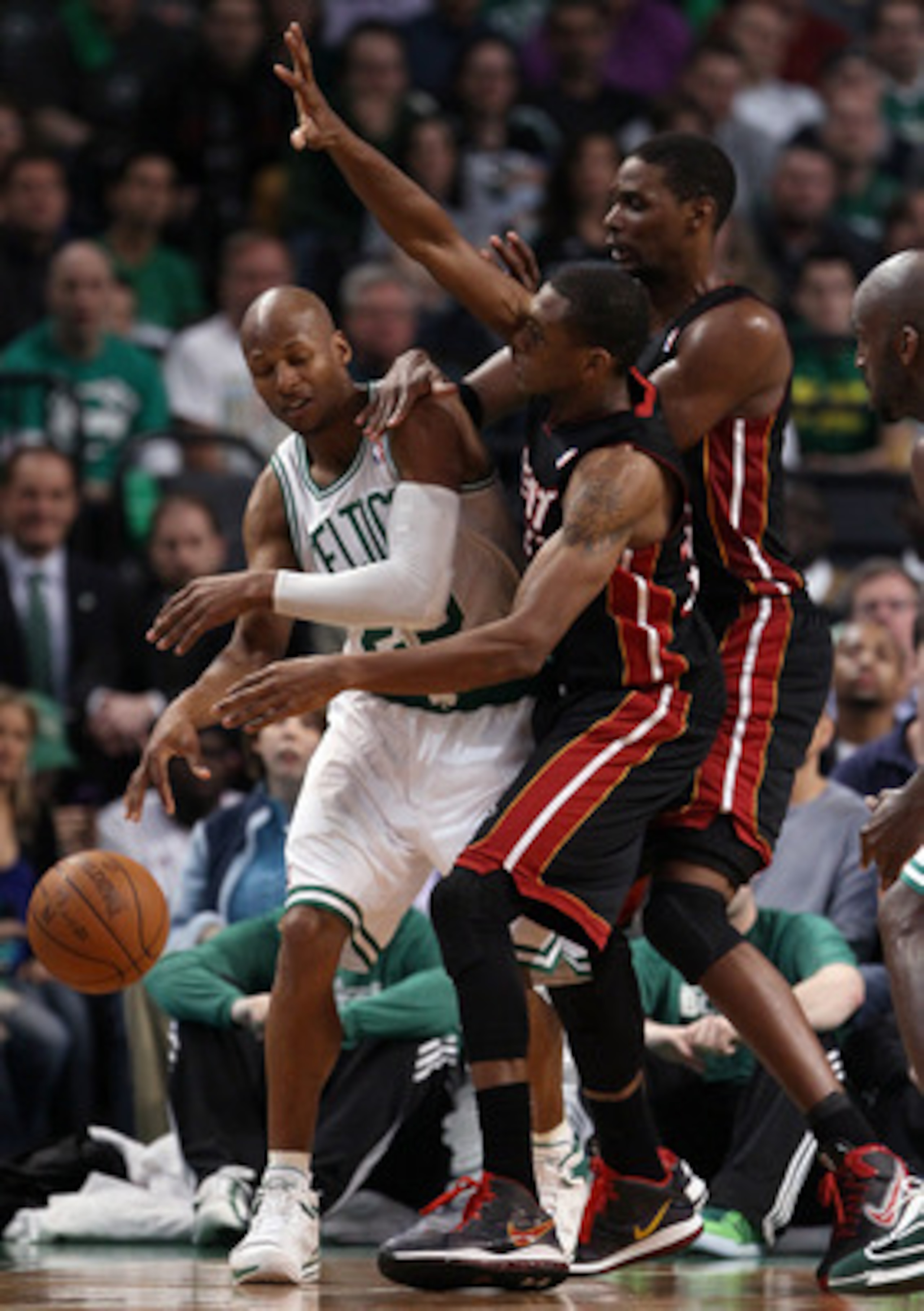 BOSTON, MA - MAY 09:  Ray Allen #20 of the Boston Celtics is pressured by James Jones #22 and Chris Bosh #1 of the Miami Heat  in Game Four of the Eastern Conference Semifinals in the 2011 NBA Playoffs on May 9, 2011 at the TD Garden in Boston, Massachuse