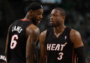 BOSTON, MA - MAY 09: LeBron James #6 talks with teamamte Dwyane Wade #3 of the Miami Heat in Game Four of the Eastern Conference Semifinals in the 2011 NBA Playoffs on May 9, 2011 at the TD Garden in Boston, Massachusetts.  The Miami Heat defeated the Bos
