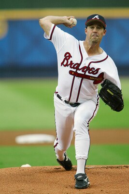 ATLANTA, GA - JULY 5:  Starting pitcher Greg Maddux #31 of the Atlanta Braves warms-up just prior to the game against the Montreal Expos at Turner Field on July 5, 2003 in Atlanta, Georgia.  The Braves won 3-2.  (Photo by Jamie Squire/Getty Images)