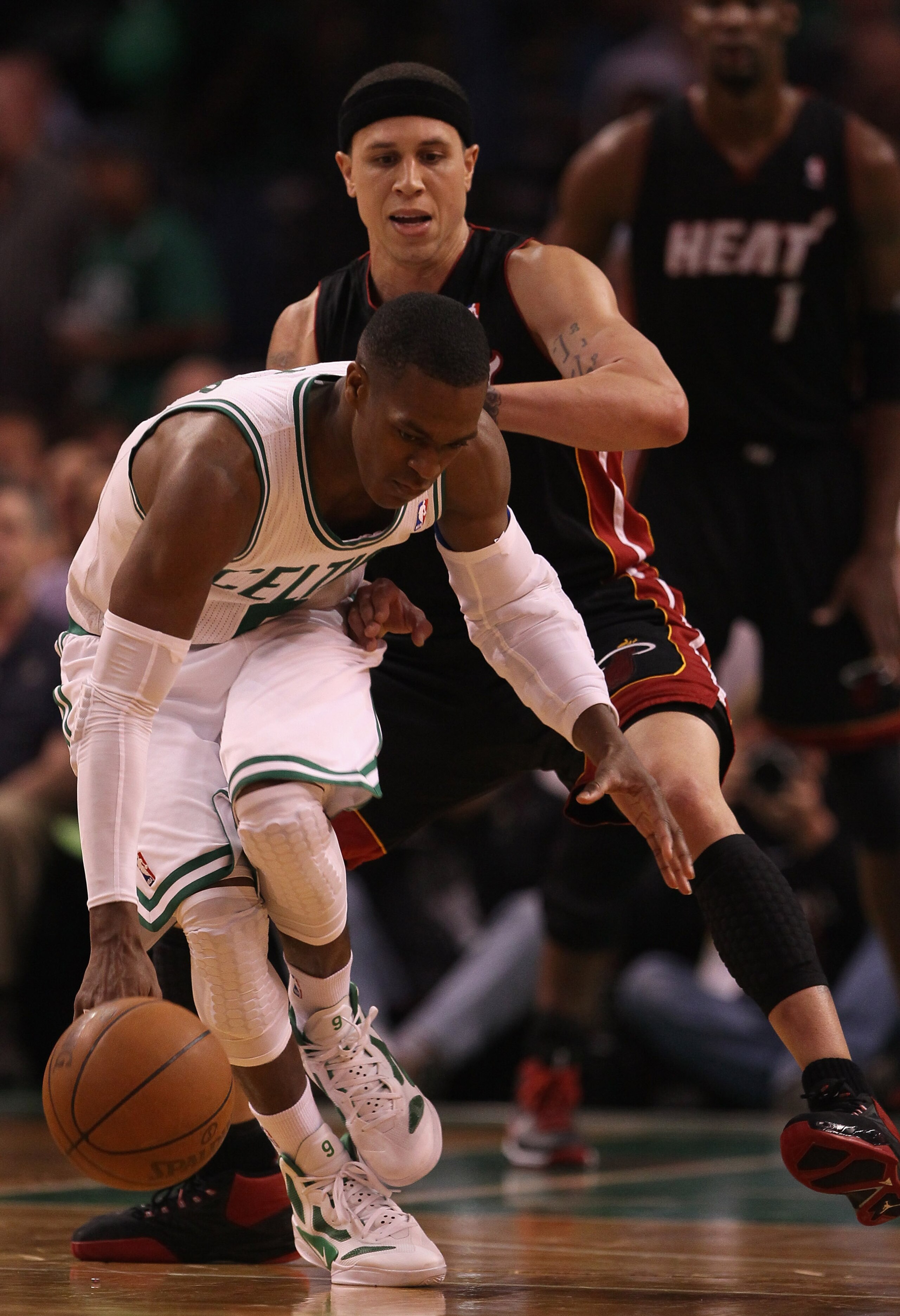 BOSTON, MA - MAY 09:  Rajon Rondo #9 of the Boston Celtics tries to keep the ball from Mike Bibby #0 of the Miami Heat in Game Four of the Eastern Conference Semifinals in the 2011 NBA Playoffs on May 9, 2011 at the TD Garden in Boston, Massachusetts.  Th