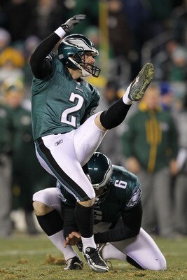 PHILADELPHIA, PA - JANUARY 09:  David Akers #2 kicks as Sav Rocca #6 of the Philadelphia Eagles holds against the Green Bay Packers during the 2011 NFC wild card playoff game at Lincoln Financial Field on January 9, 2011 in Philadelphia, Pennsylvania.  (P