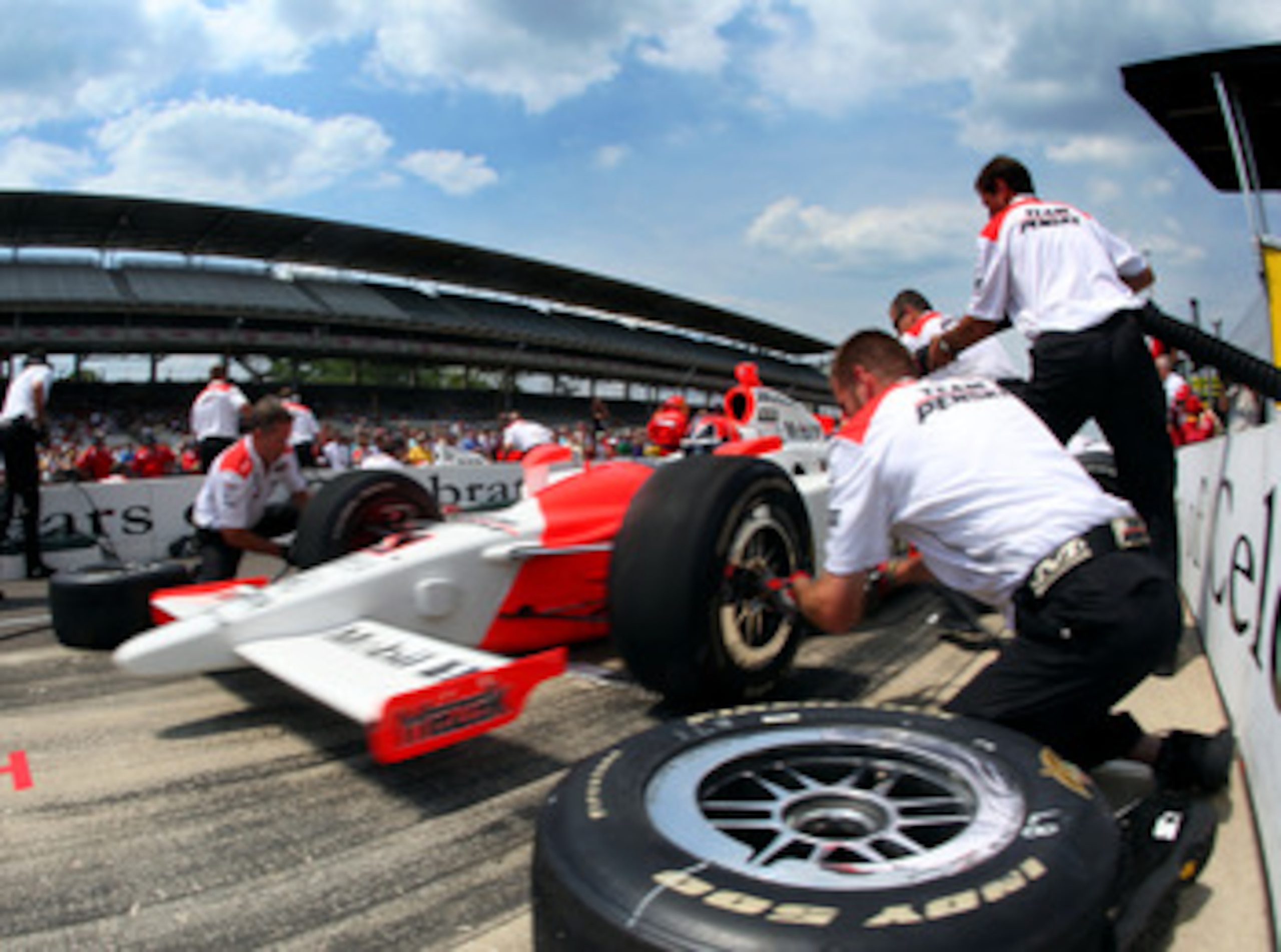 INDIANAPOLIS - MAY 22:  Helio Castroneves, driver of the #3 TEam Penske Dallara Honda, competes to win the Indy 500 Pit Stop Challenge during the Miller Lite Carb Day practice for the IRL IndyCar Series 93rd running of the Indianapolis 500 on May 22, 2009