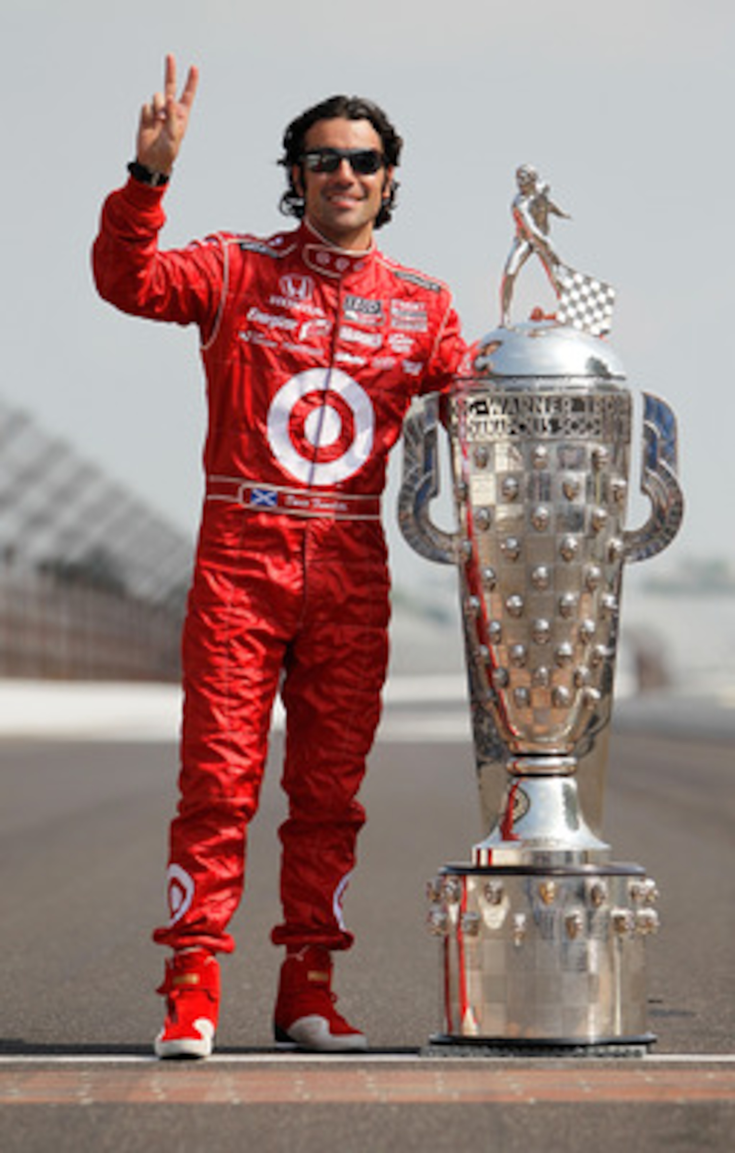 INDIANAPOLIS - MAY 31:  Dario Franchitti of Scotland, driver of the #10 Target Chip Ganassi Racing Dallara Honda, poses with Borg Warner Trophy on the yard of bricks during the 94th Indianapolis 500 Trophy Presentation at the Indianapolis Motor Speedway o