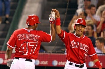 ANAHEIM, CA - AUGUST 21:  (L-R) Howie Kendrick #47 and Maicer Izturis #6 of the Los Angeles Angels of Anaheim celebrates after scoring in the second inning against the New York Yankees at Angels Stadium on August 21, 2007 in Anaheim, California.  (Photo b