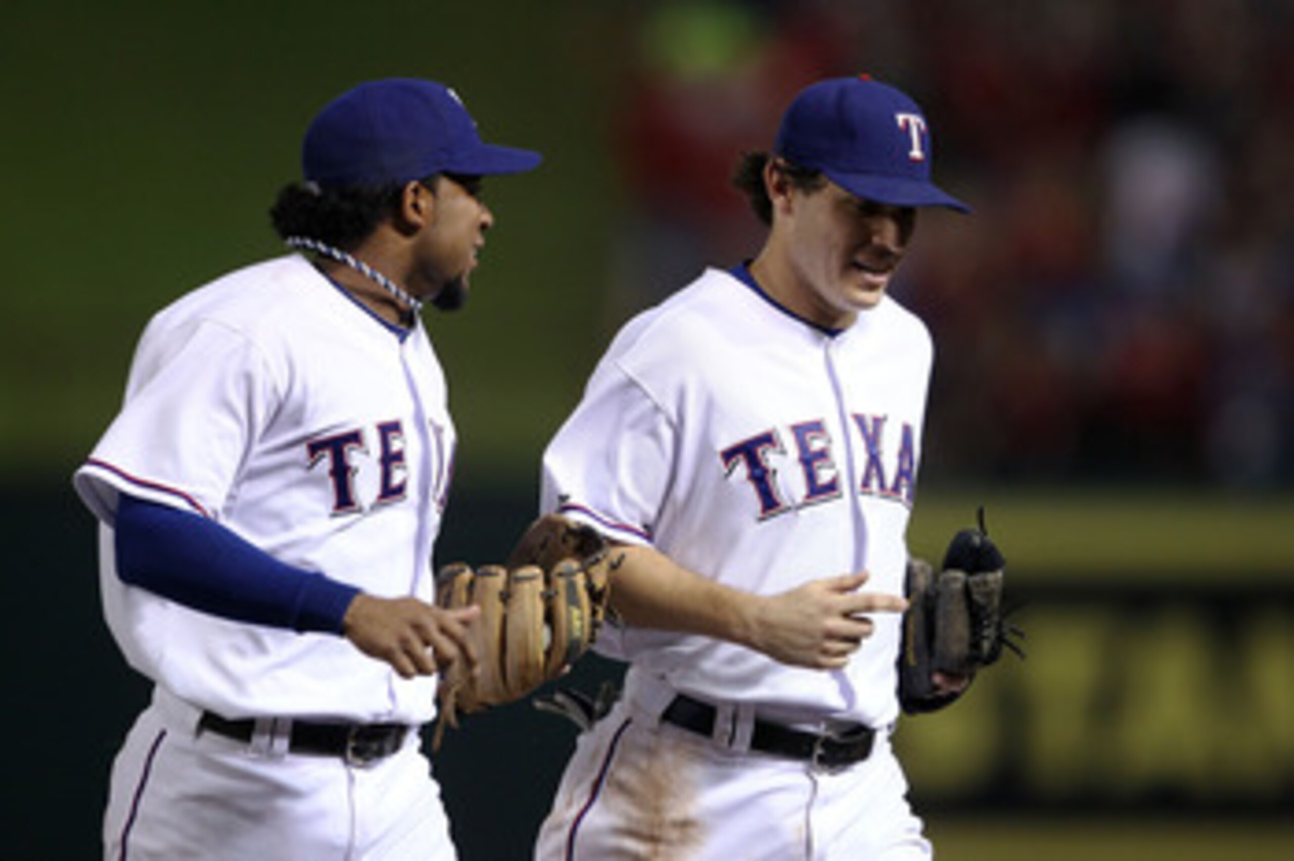 ARLINGTON, TX - OCTOBER 22:  (L-R) Elvis Andrus #1 and Ian Kinsler #5 of the Texas Rangers run off the infield towards the dugout at the end of an inning against  the New York Yankees in Game Six of the ALCS during the 2010 MLB Playoffs at Rangers Ballpar