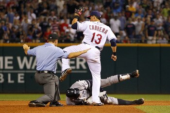 CLEVELAND - JULY 28:  Alex Rodriguez #13 of the New York Yankees is called safe after a sixth inning double next to Asdrubal Cabrera #13 of the Cleveland Indians on July 28, 2010 at Progressive Field in Cleveland, Ohio.  (Photo by Gregory Shamus/Getty Ima