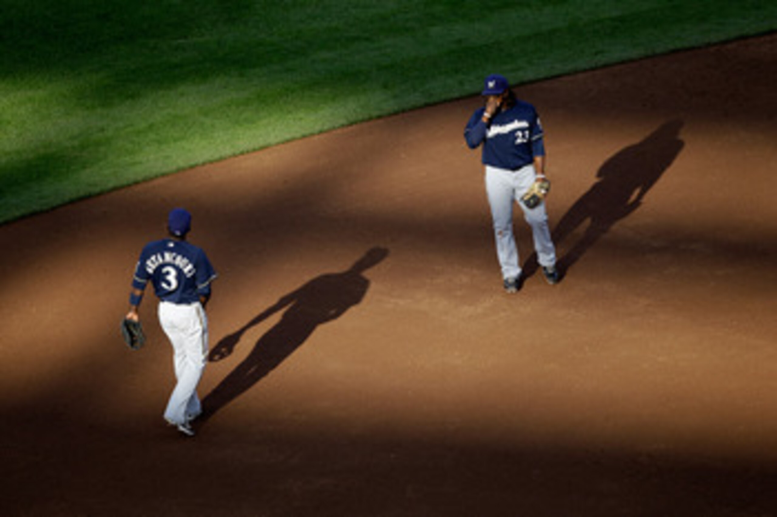 WASHINGTON, DC - APRIL 17:  Yuniesky Betancourt #3 of the Milwaukee Brewers and Rickie Weeks #23 during the second game of a doubleheader against the Washington Nationals at Nationals Park on April 17, 2011 in Washington, DC.  (Photo by Rob Carr/Getty Ima