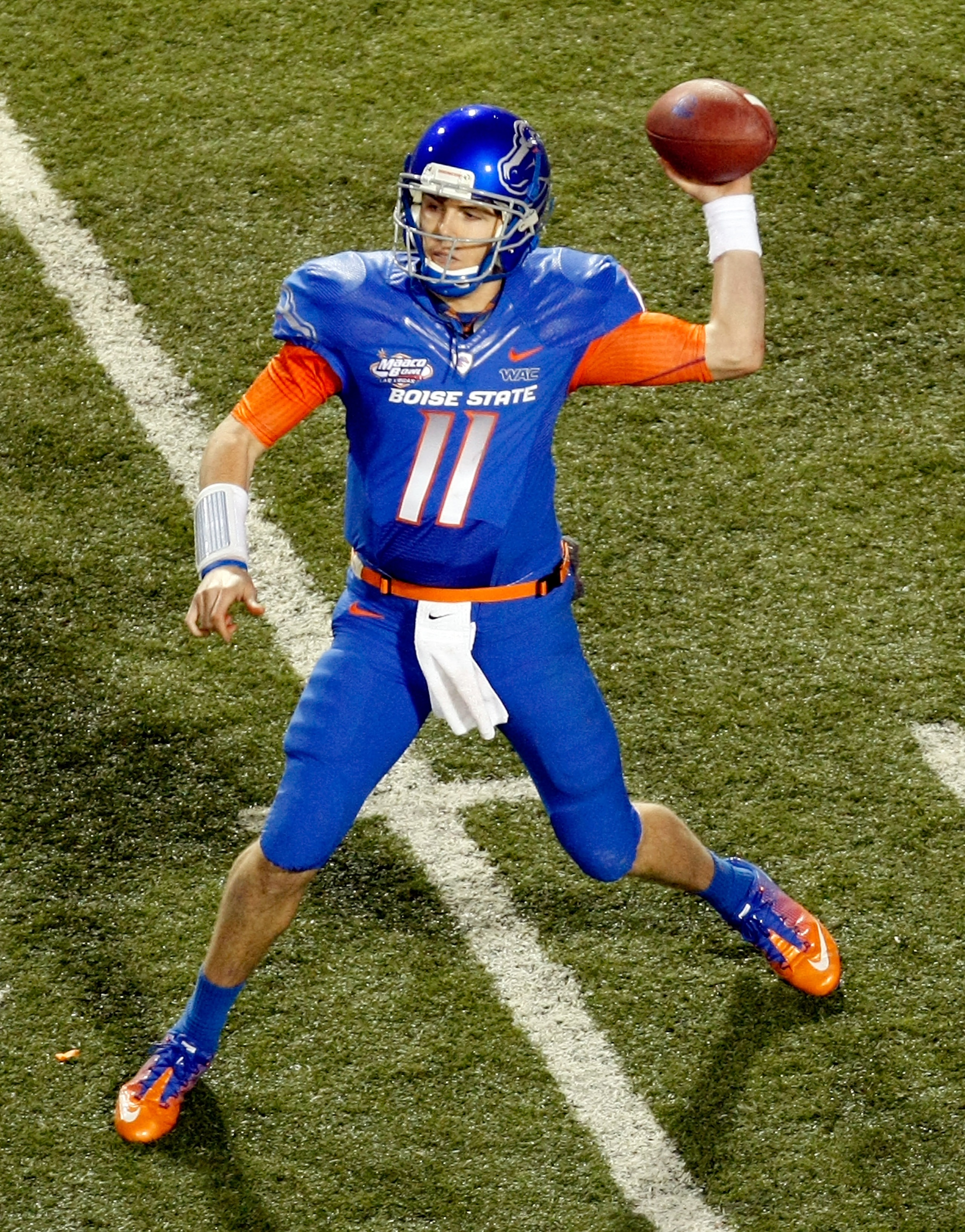 LAS VEGAS, NV - DECEMBER 22:  Quarterback Kellen Moore #11 of the Boise State Broncos throws for yardage against the Utah Utes during the MAACO Bowl Las Vegas at Sam Boyd Stadium December 22, 2010 in Las Vegas, Nevada. Boise State Won 26-3.  (Photo by Eth