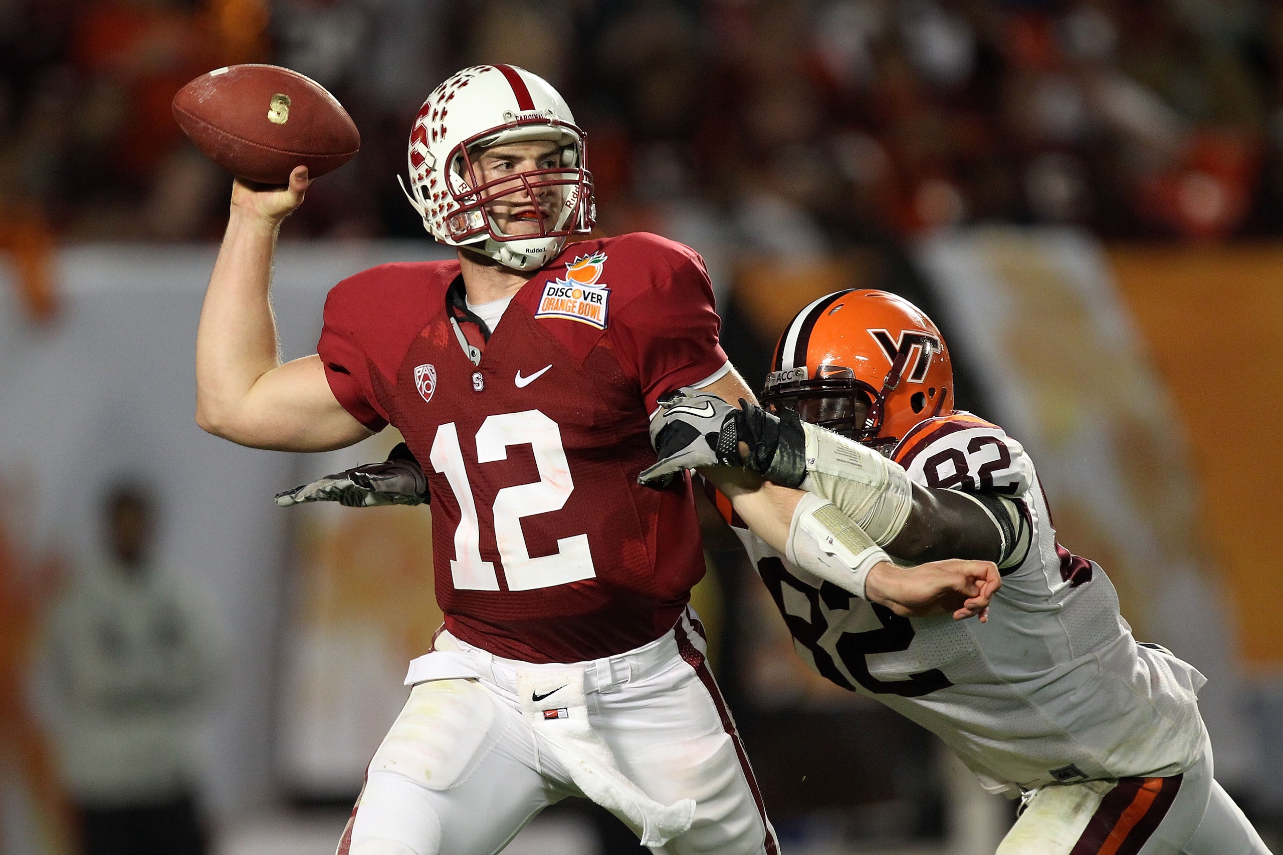 MIAMI, FL - JANUARY 03: Andrew Luck #12 of the Stanford Cardinal throws a pass against Steven Friday #82 of the Virginia Tech Hokies during the 2011 Discover Orange Bowl at Sun Life Stadium on January 3, 2011 in Miami, Florida. (Photo by Streeter Lecka/Ge