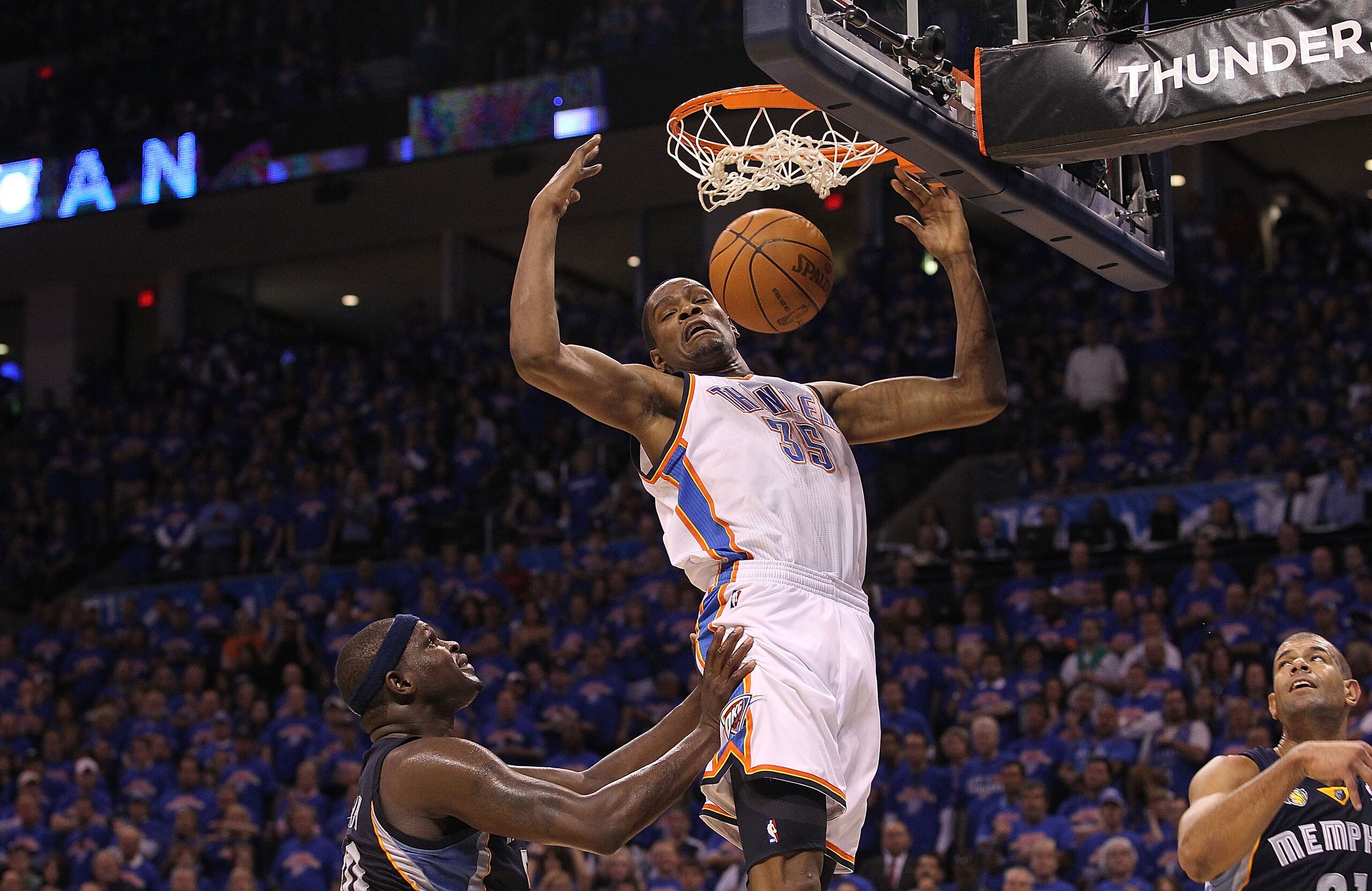 OKLAHOMA CITY, OK - MAY 15:  Forward Kevin Durant #35 of the Oklahoma City Thunder gets the slam dunk against Zach Randolph #50 of the Memphis Grizzlies in Game Seven of the Western Conference Semifinals in the 2011 NBA Playoffs on May 15, 2011 at Oklahom