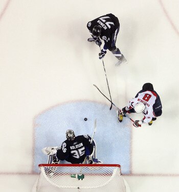 TAMPA, FL - MAY 04:  Dwayne Roloson #35 and Victor Hedman #77 of the Tampa Bay Lightning defend against Alex Ovechkin #8 of the Washington Capitals in Game Four of the Eastern Conference Semifinals during the 2011 NHL Stanley Cup Playoffs at the St Pete T