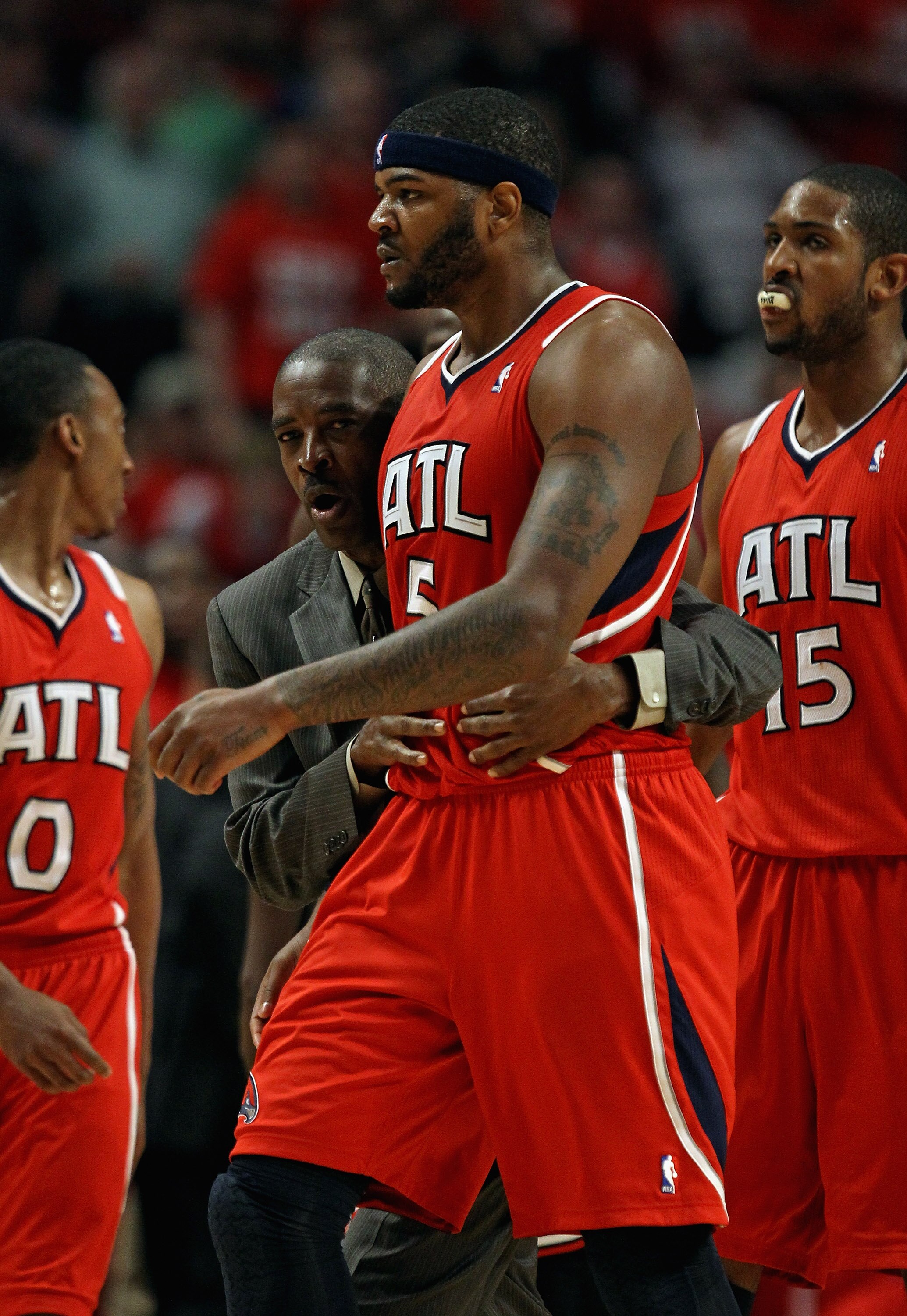CHICAGO, IL - MAY 10: Head coach Larry Drew of the Atlanta Hawks walks down the court with Josh Smith #5 after an altercation against the Chicago Bulls in Game Five of the Eastern Conference Semifinals in the 2011 NBA Playoffs at the United Center on May