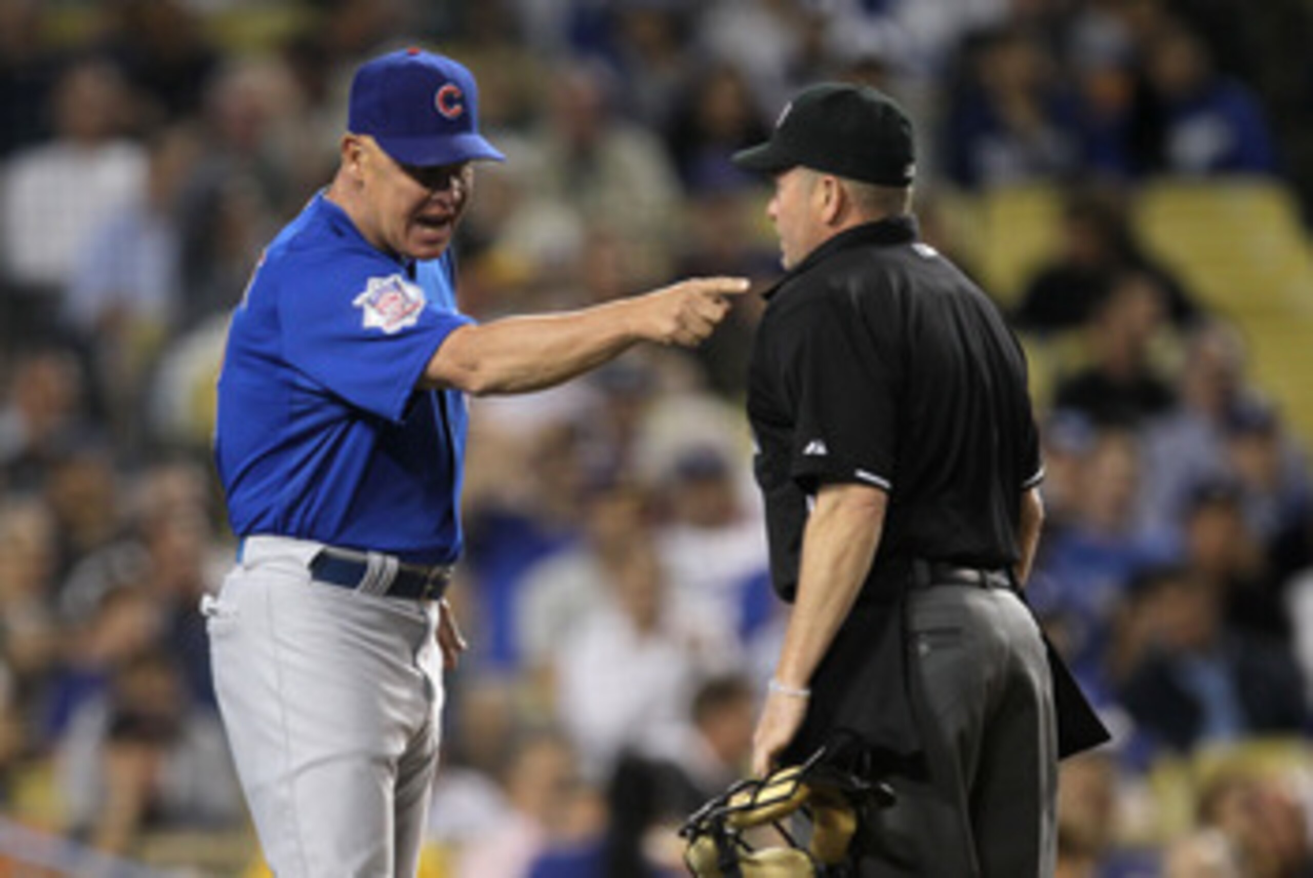 LOS ANGELES - MAY 2:  Manager Mike Quade of the Chicago Cubs argues with home plate umpire Jerry Meals in the game with the Los Angeles Dodgers on May 2, 2011 at Dodger Stadium in Los Angeles, California.  (Photo by Stephen Dunn/Getty Images)
