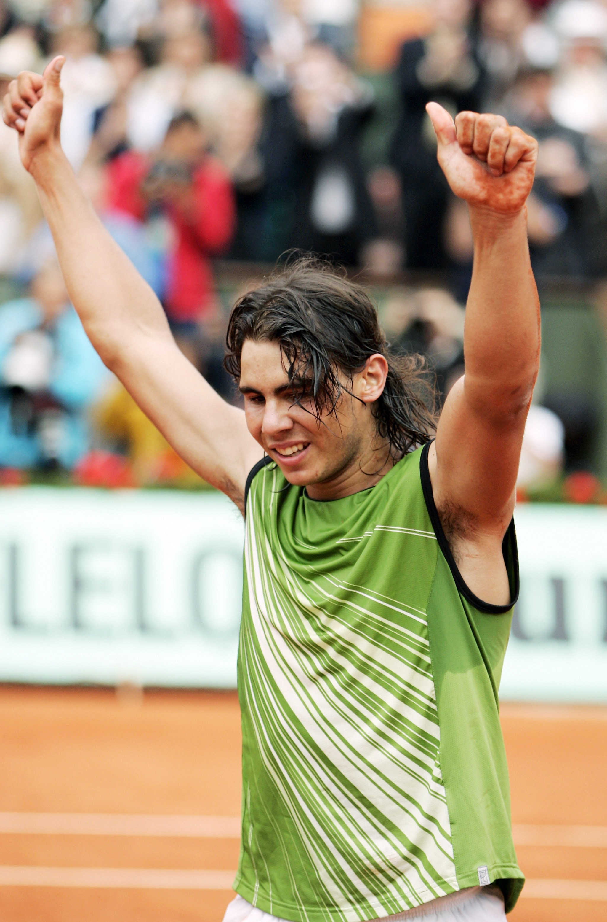 PARIS - JUNE 05:  Rafael Nadal of Spain celebrates match point during the Mens Final match on the fourteenth day of the French Open at Roland Garros on June 5, 2005 in Paris, France.  (Photo by Clive Mason/Getty Images)