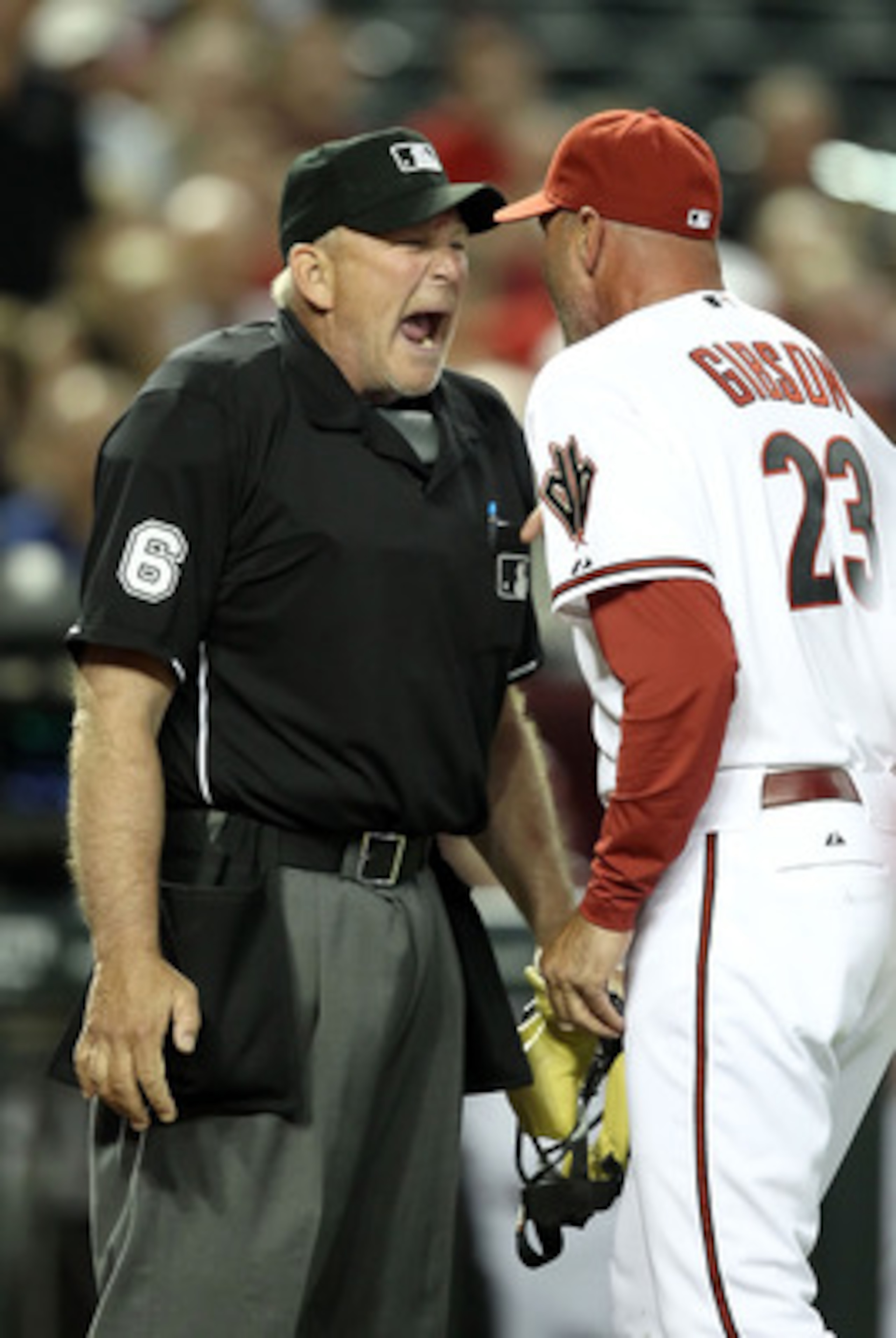 PHOENIX, AZ - APRIL 12:  Manager Kirk Gibson of the Arizona Diamondbacks argues with home plate home plate umpire Bob Davidson after being ejected from the Major League Baseball game against the St. Louis Cardinals at Chase Field on April 12, 2011 in Phoe