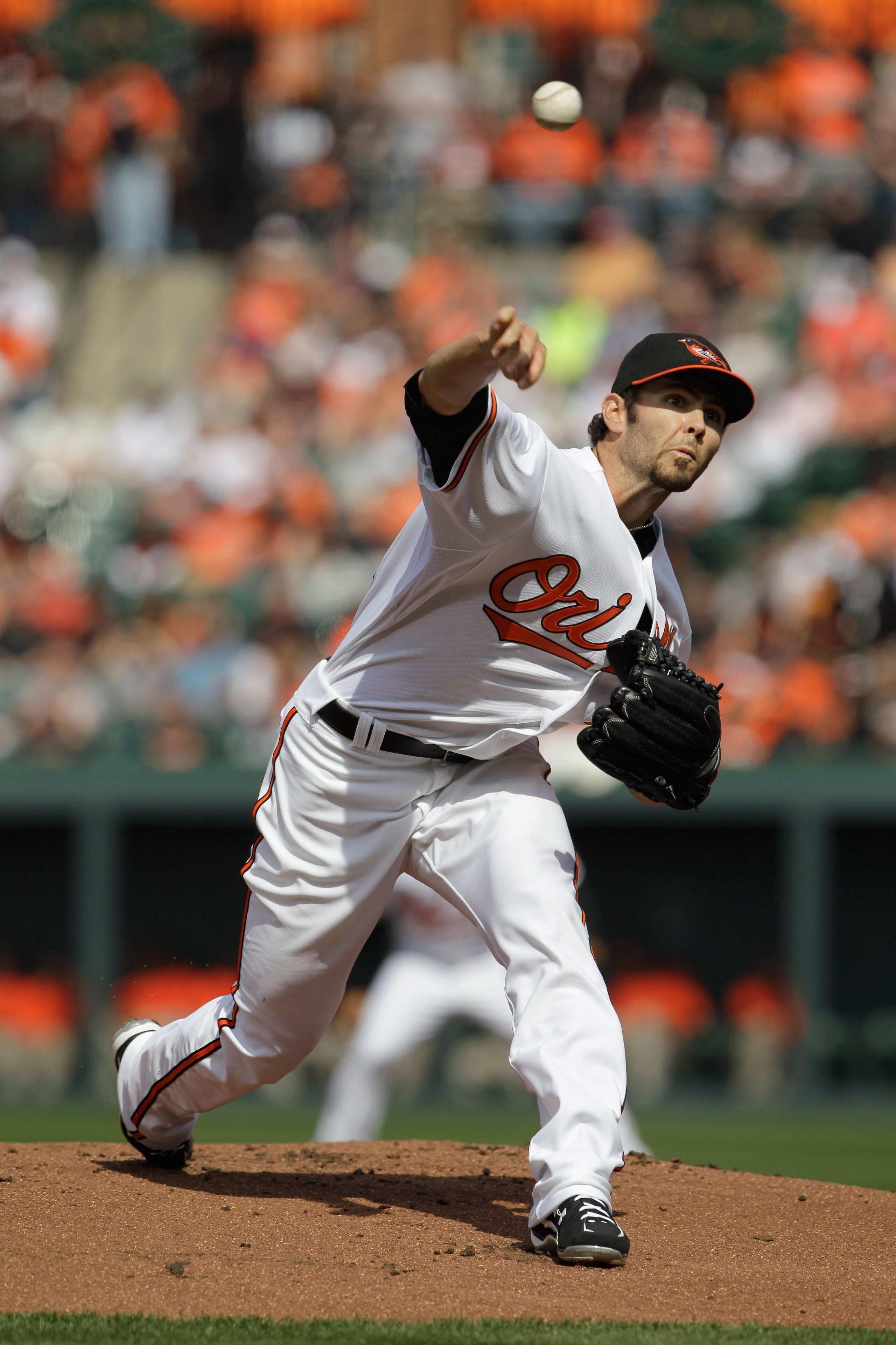 BALTIMORE, MD - APRIL 04:  Starting pitcher Jake Arrieta #34 of the Baltimore Orioles delivers to a Detroit Tigers batter during the second inning during opening day at Oriole Park at Camden Yards on April 4, 2011 in Baltimore, Maryland.  (Photo by Rob Ca