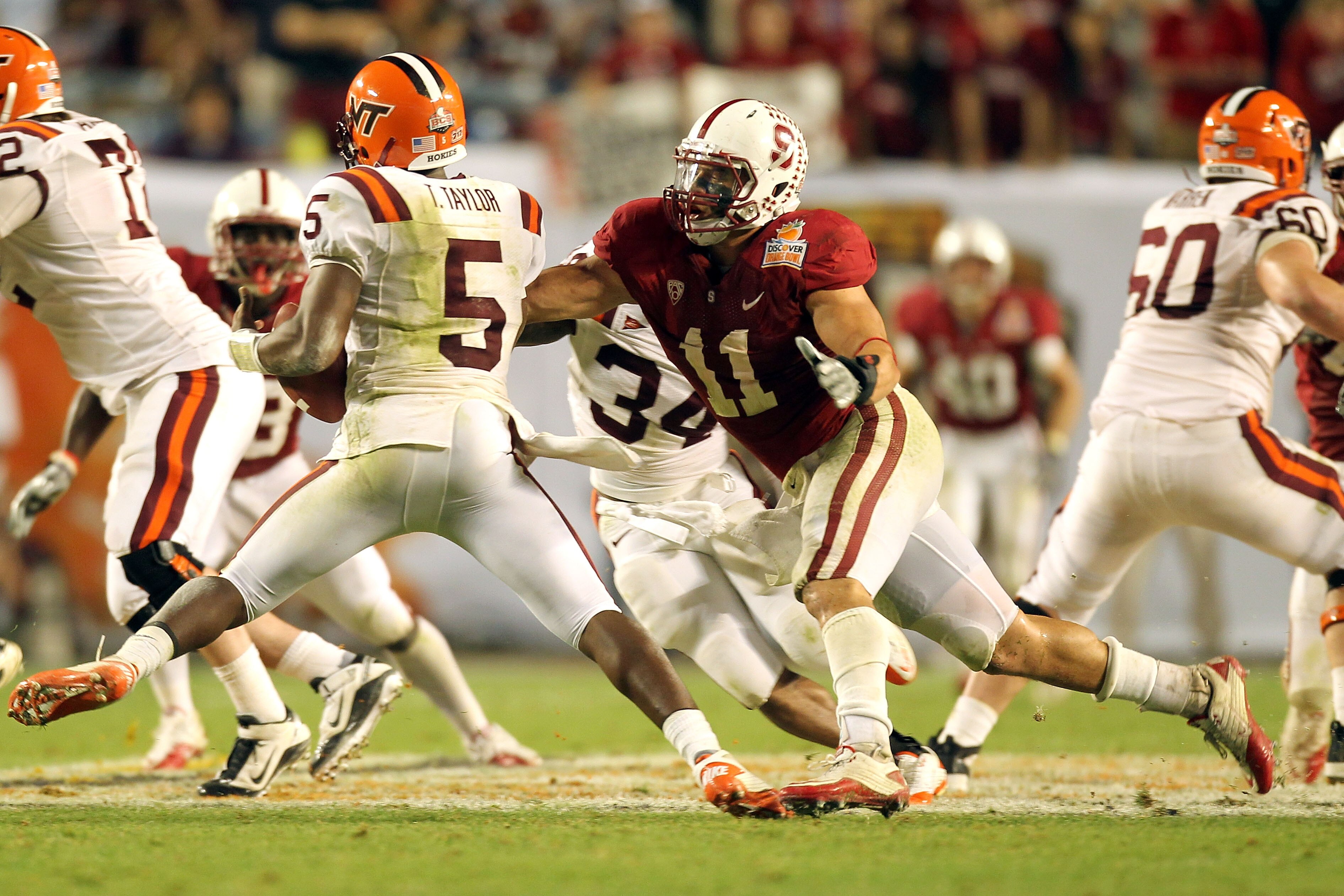 MIAMI, FL - JANUARY 03:  Shayne Skov #11 of the Stanford Cardinal chases down Tyrod Taylor #5 of the Virginai Tech Hokies during the 2011 Discover Orange Bowl at Sun Life Stadium on January 3, 2011 in Miami, Florida. Stanford won 40-12. (Photo by Mike Ehr