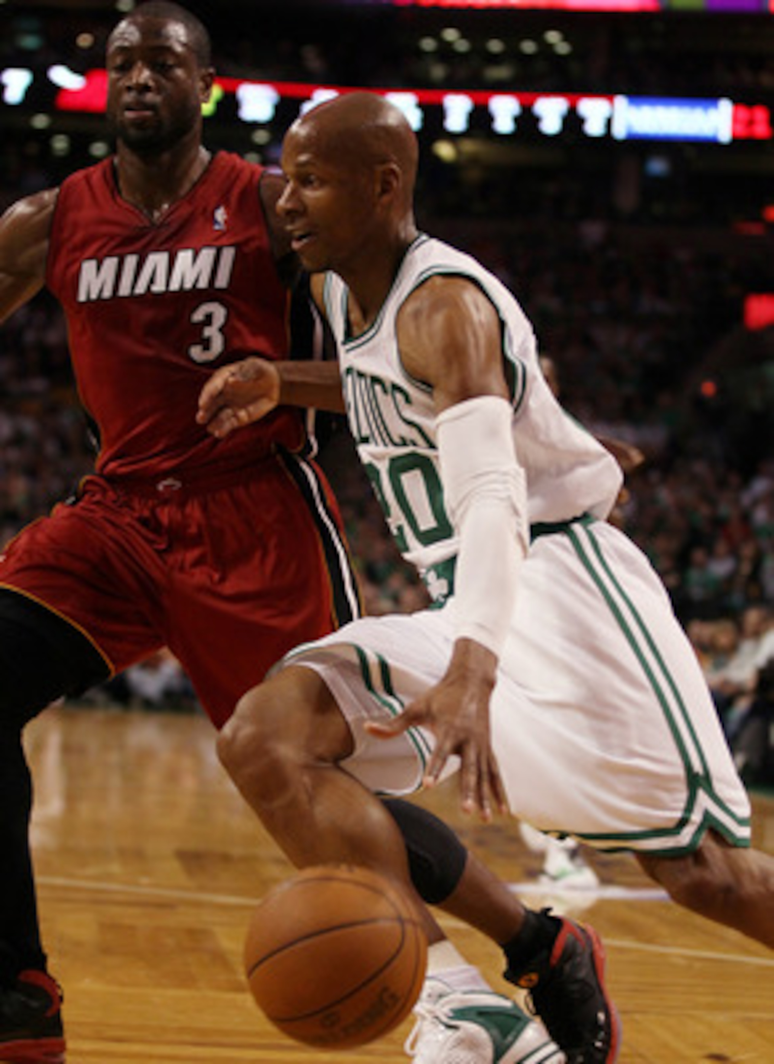 BOSTON, MA - MAY 07:  Ray Allen #20 of the Boston Celtics drives to the net as Dwyane Wade #3 of the Miami Heat defends in Game Three of the Eastern Conference Semifinals in the 2011 NBA Playoffs on May 7, 2011 at the TD Garden in Boston, Massachusetts.