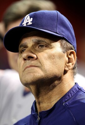 PHOENIX - SEPTEMBER 24:  Manager Joe Torre of the Los Angeles Dodgers watches from the dugout during the Major League Baseball game against the Arizona Diamondbacks at Chase Field on September 24, 2010 in Phoenix, Arizona.  (Photo by Christian Petersen/Ge
