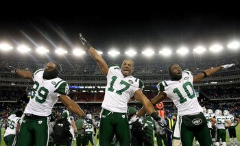 FOXBORO, MA - JANUARY 16:  Jerricho Cotchery #89, Braylon Edwards #17 and Santonio Holmes #10 of the New York Jets celebrate their 28 to 21 victory over the New England Patriots during their 2011 AFC divisional playoff game at Gillette Stadium on January 