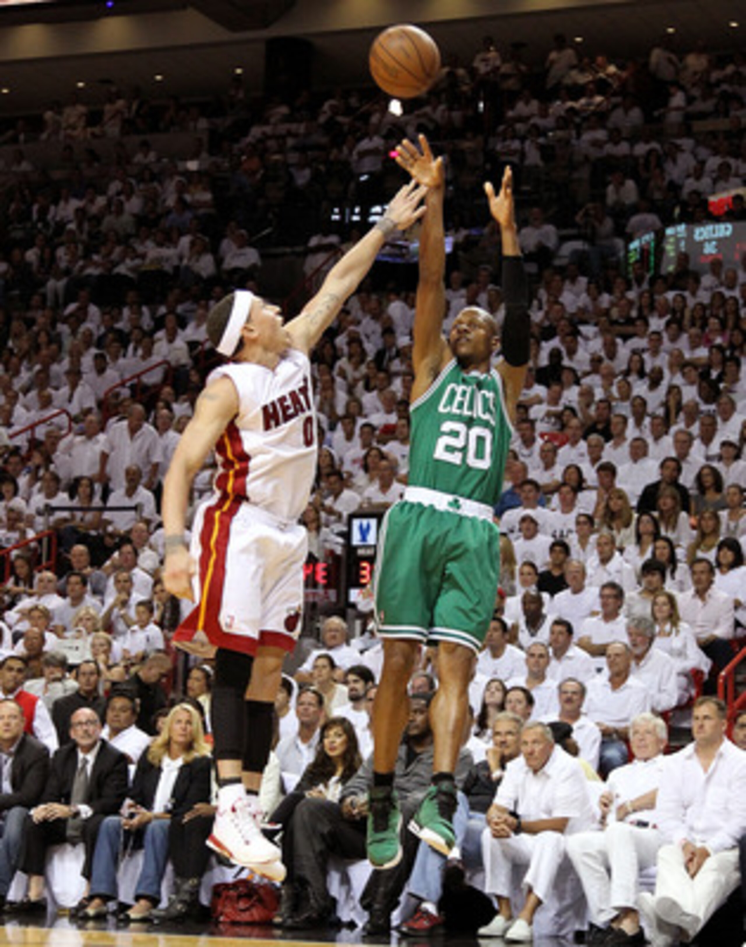 MIAMI, FL - MAY 03:  Ray Allen #20 of the Boston Celtics takes a shot against Mike Bibby #0 of  the Miami Heat during Game Two of the Eastern Conference Semifinals of the 2011 NBA Playoffs at American Airlines Arena on May 3, 2011 in Miami, Florida. NOTE