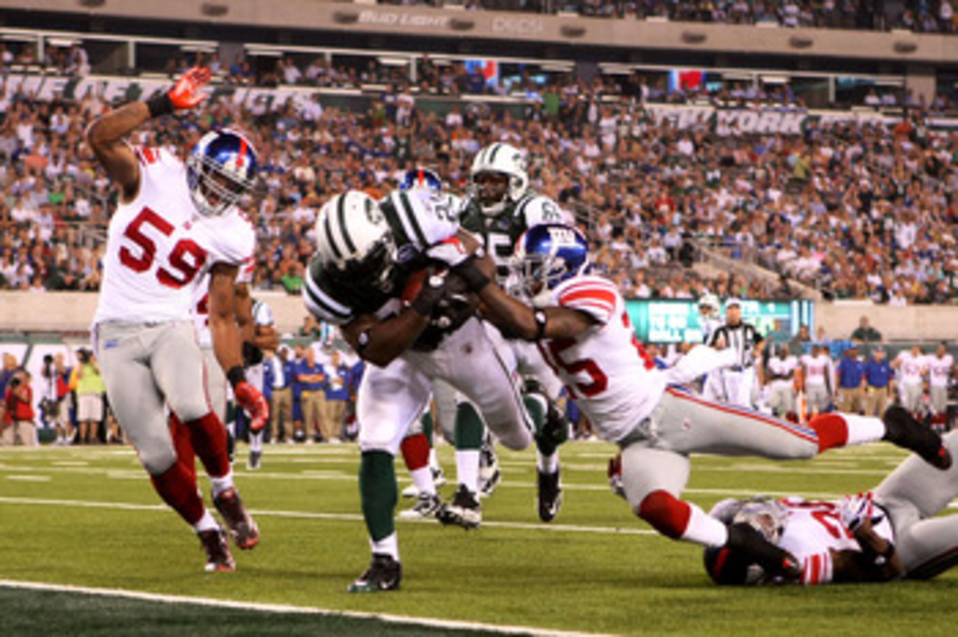 EAST RUTHERFORD, NJ - AUGUST 16: LaDanian Tomlinson #21 of the New York Jets falls into the endzone for a touchdown that was eventually called back during their game against the New York Giants at New Meadowlands Stadium on August 16, 2010 in East Ruther EAST RUTHERFORD, NJ - AUGUST 16: LaDanian Tomlinson #21 of the New York Jets falls into the endzone for a touchdown that was eventually called back during their game against the New York Giants at New Meadowlands Stadium on August 16, 2010 in East Ruther