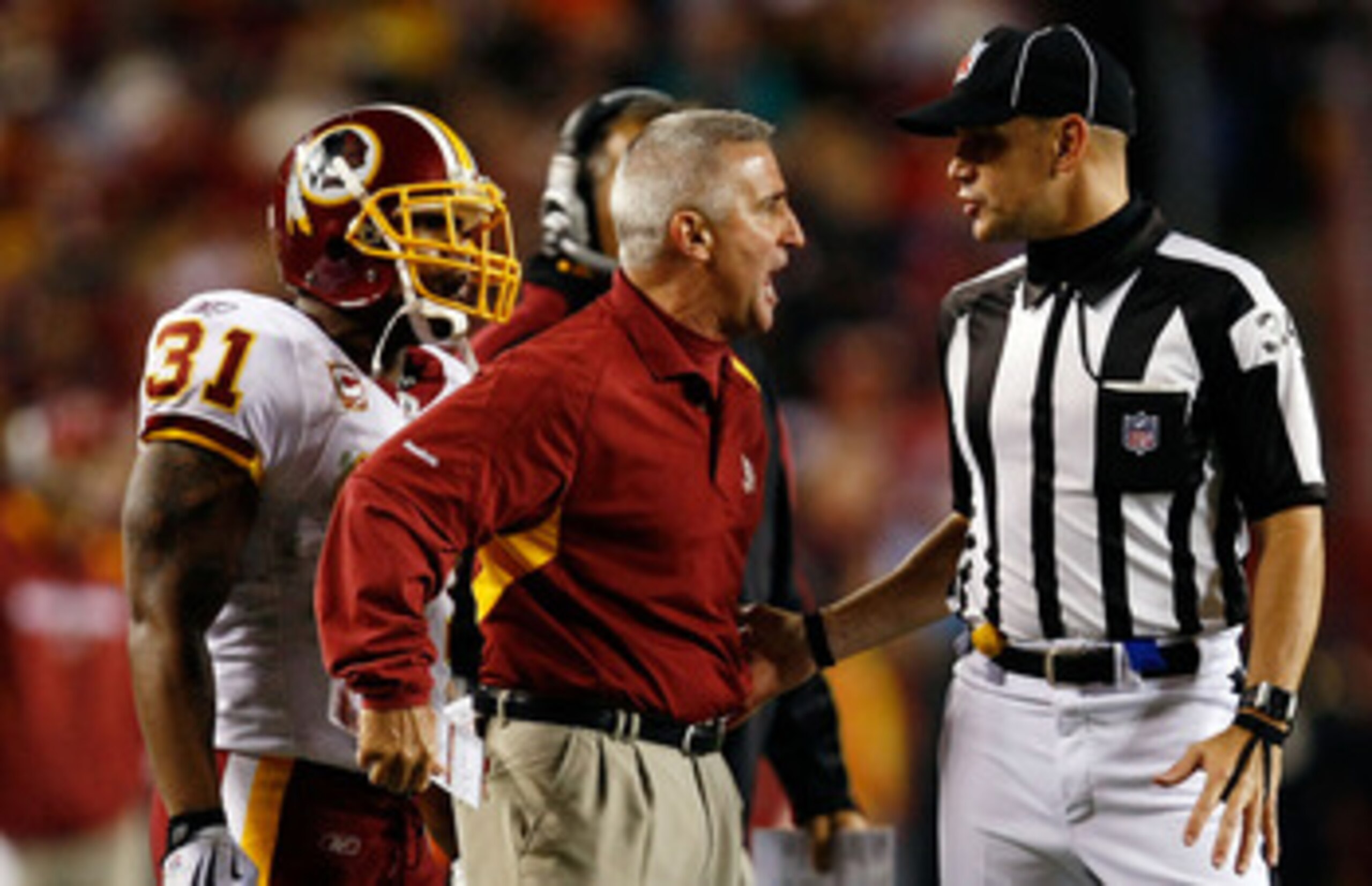 LANDOVER, MD - OCTOBER 26:  Special teams coach Danny Smith of the Washington Redskins argues with a referee during the game against the Philadelphia Eagles at FedEx Field October 26, 2009 in Landover, Maryland. The Eagles won the game 27-17.  (Photo by W