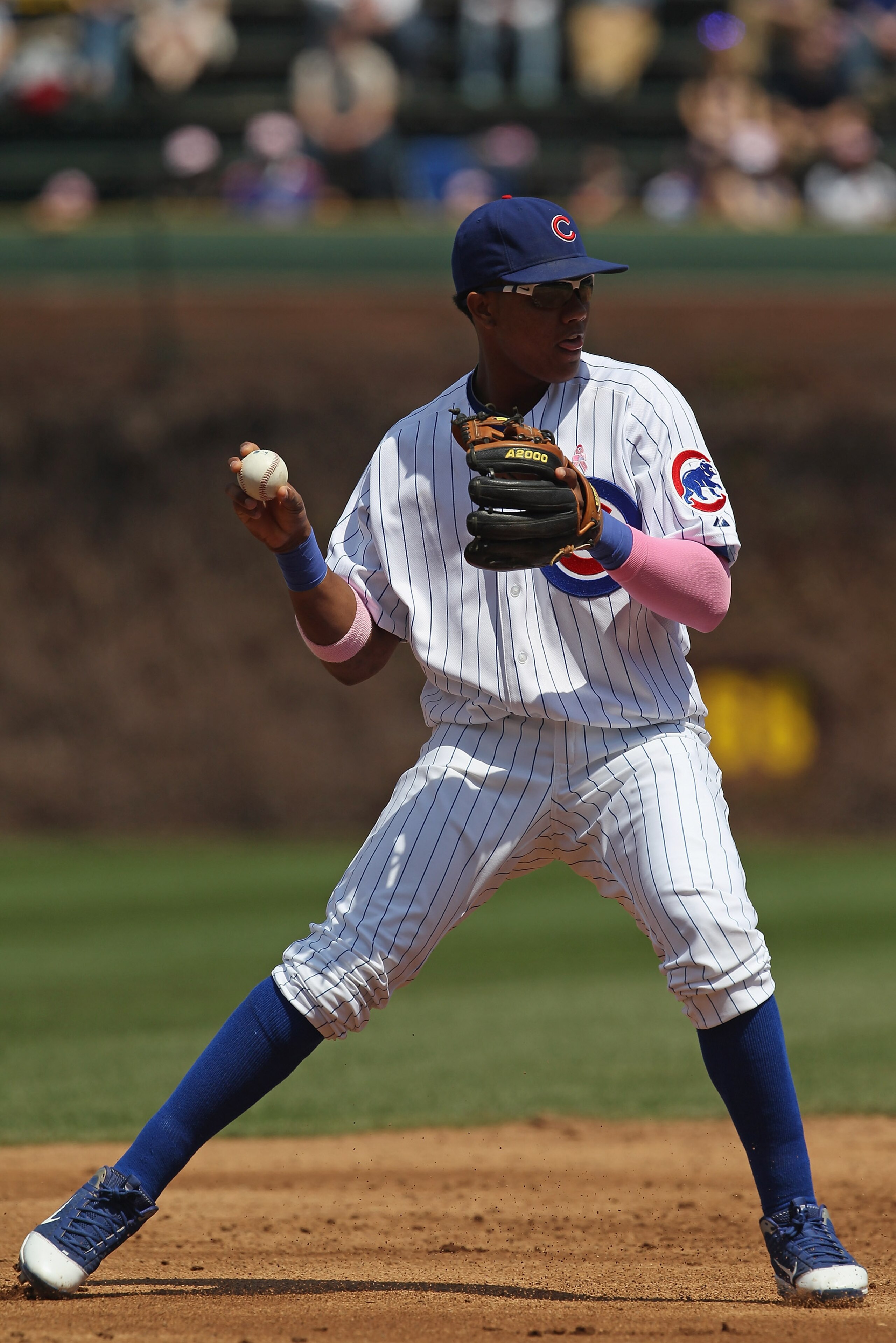 CHICAGO, IL - MAY 08: Starlin Castro #13 of the Chicago Cubs throws to 1st base against the Cincinnati Reds at Wrigley Field on May 8, 2011 in Chicago, Illinois. The Reds defeated the Cubs 2-0.  (Photo by Jonathan Daniel/Getty Images)