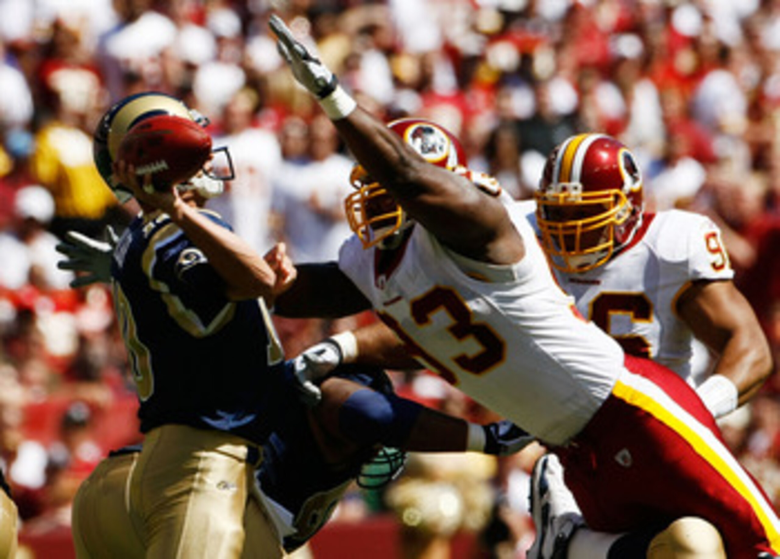 LANDOVER, MD - SEPTEMBER 20:  Mark Bulger #10 of the St. Louis Rams tries to avoid Phillip Daniels #92 of the Washington Redskins during their game on September 20, 2009 at FedEx Field in Landover, Maryland. (Photo by Win McNamee/Getty Images)