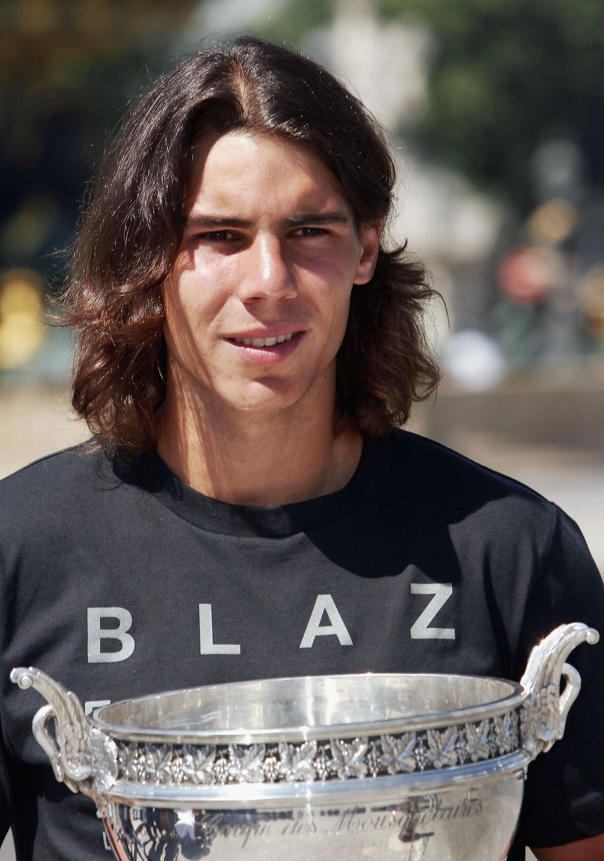 PARIS - JUNE 12:  Spanish tennis star Rafael Nadal poses with his trophy in the Place de la Concorde on June 12, 2006 in Paris, France. Nadal won the French Open final. beating Roger Federer at Roland Garros 1-6, 6-1, 6-4, 7-6.  (Photo by Francois Durand/