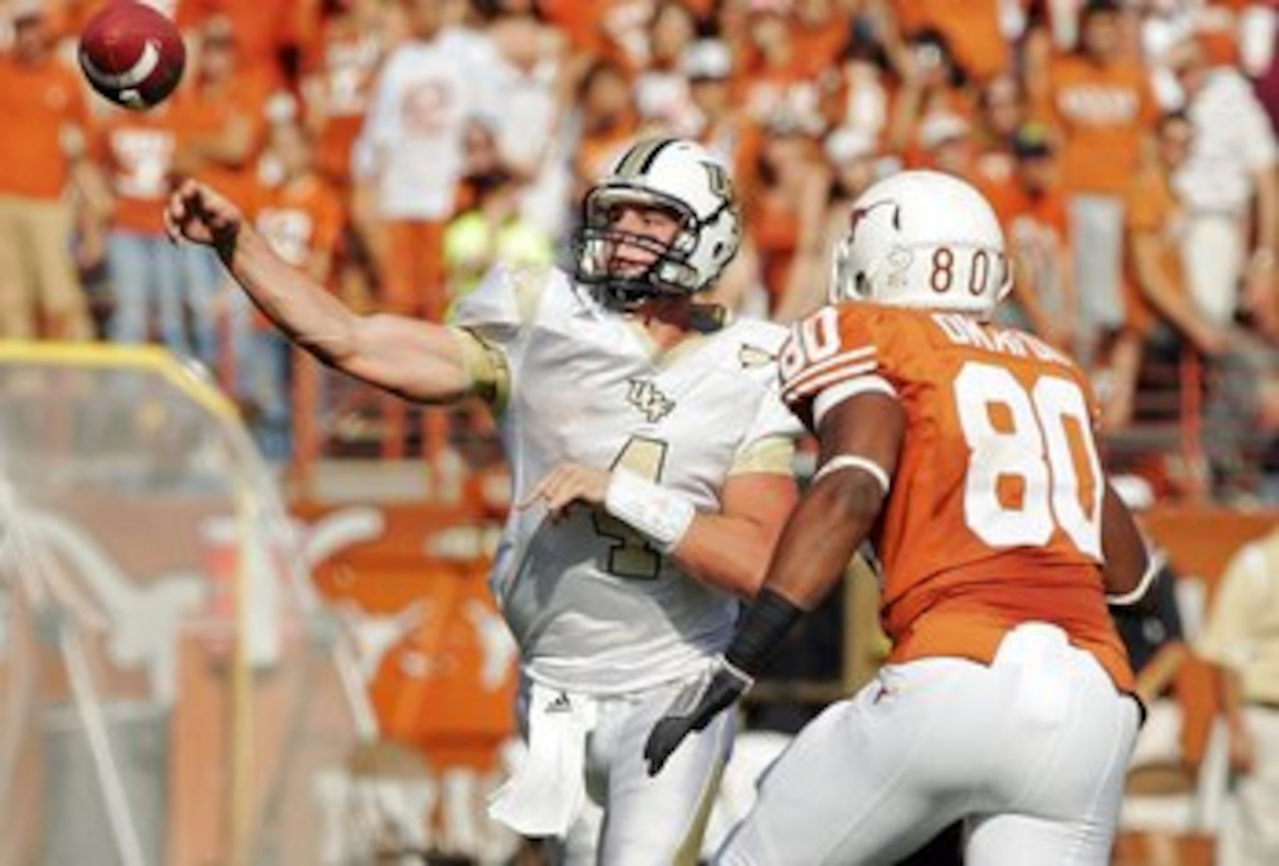 AUSTIN, TX - NOVEMBER 07: Quarterback Rob Calabrese #4 of the UCF Kights throws past defensive end Alex Okafor#80 of the Texas Longhorns on November 7, 2009 at Darrell K Royal - Texas Memorial Stadium in Austin, Texas. Texas won 35-3. (Photo by Brian B AUSTIN, TX - NOVEMBER 07: Quarterback Rob Calabrese #4 of the UCF Kights throws past defensive end Alex Okafor#80 of the Texas Longhorns on November 7, 2009 at Darrell K Royal - Texas Memorial Stadium in Austin, Texas. Texas won 35-3. (Photo by Brian B