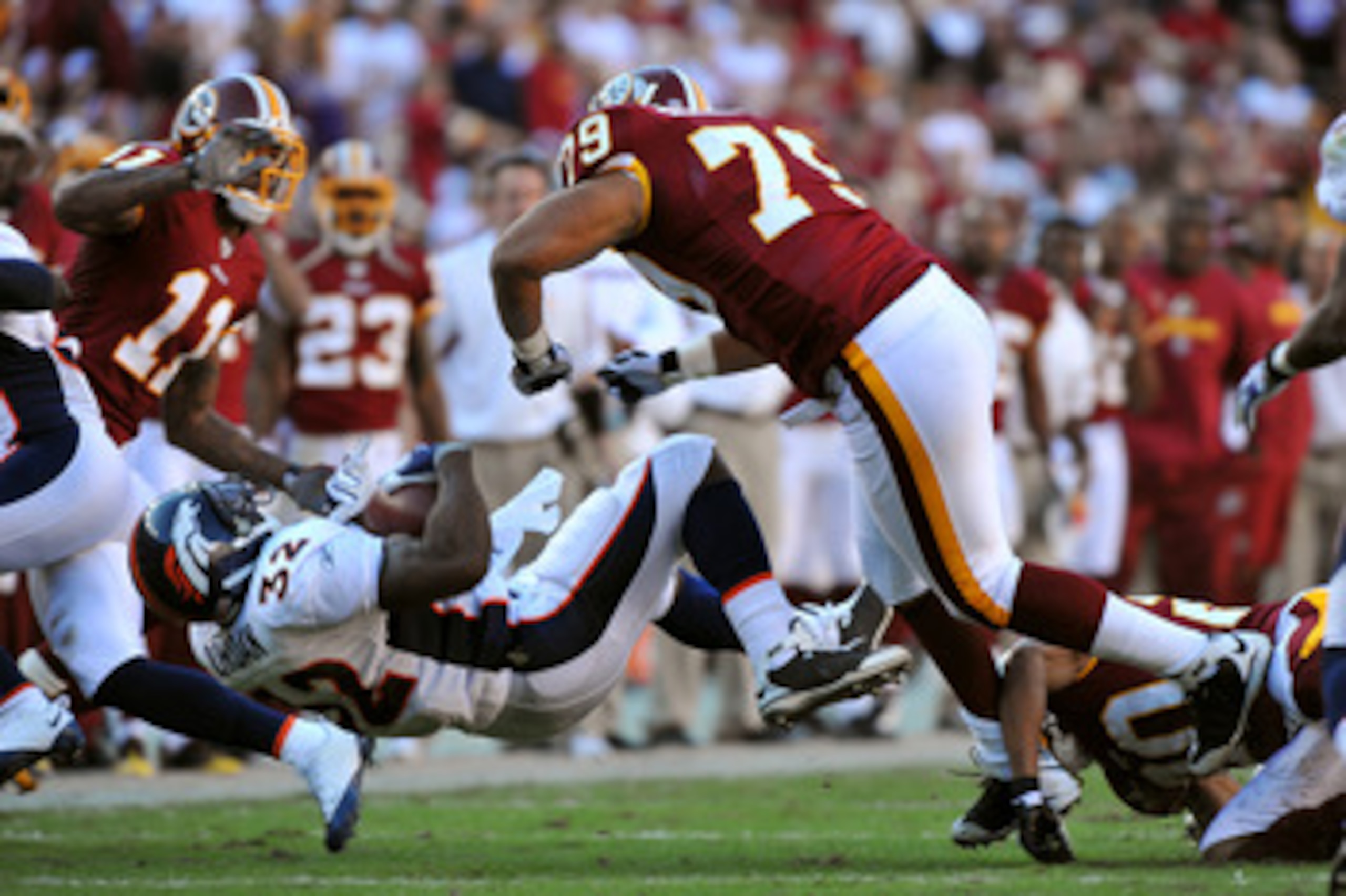 LANDOVER, MD - NOVEMBER 15:  Lorenzo Alexander #79 of the Washington Redskins flattens Lamont Jordan #32 of the Denver Broncos at FedExField on November 15, 2009 in Landover, Maryland. The Redskins defeated the Broncos 27-17. (Photo by Larry French/Getty