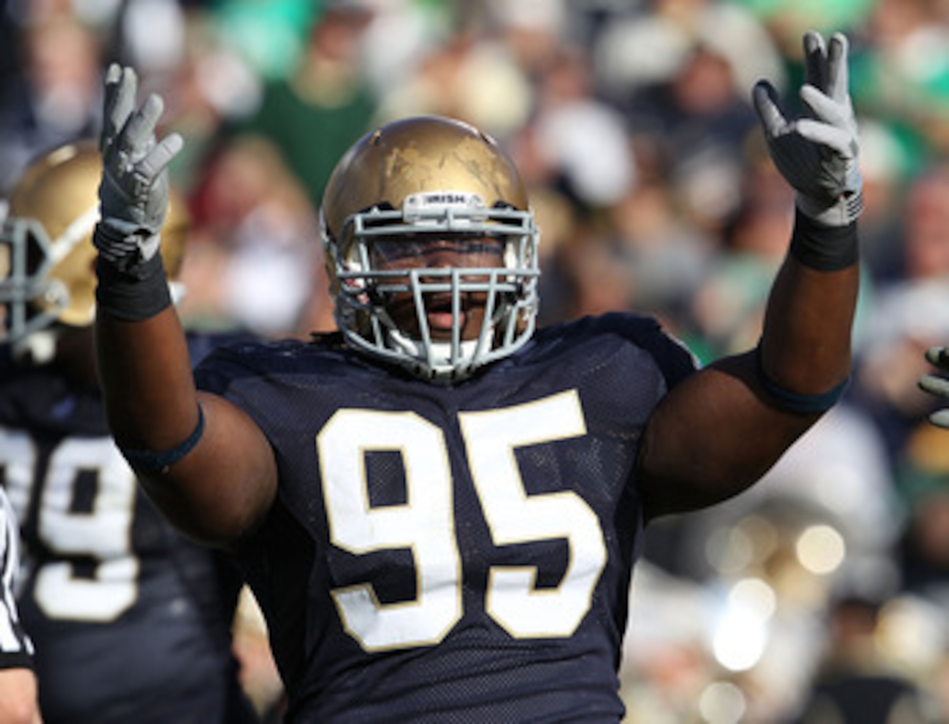 SOUTH BEND, IN - SEPTEMBER 04: Ian Williams #95 of the Notre Dame Fighting Irish encourages the crowd during a game against the Purdue Boilermakers at Notre Dame Stadium on September 4, 2010 in South Bend, Indiana. Notre Dame defeated Purdue 23-12. (Photo