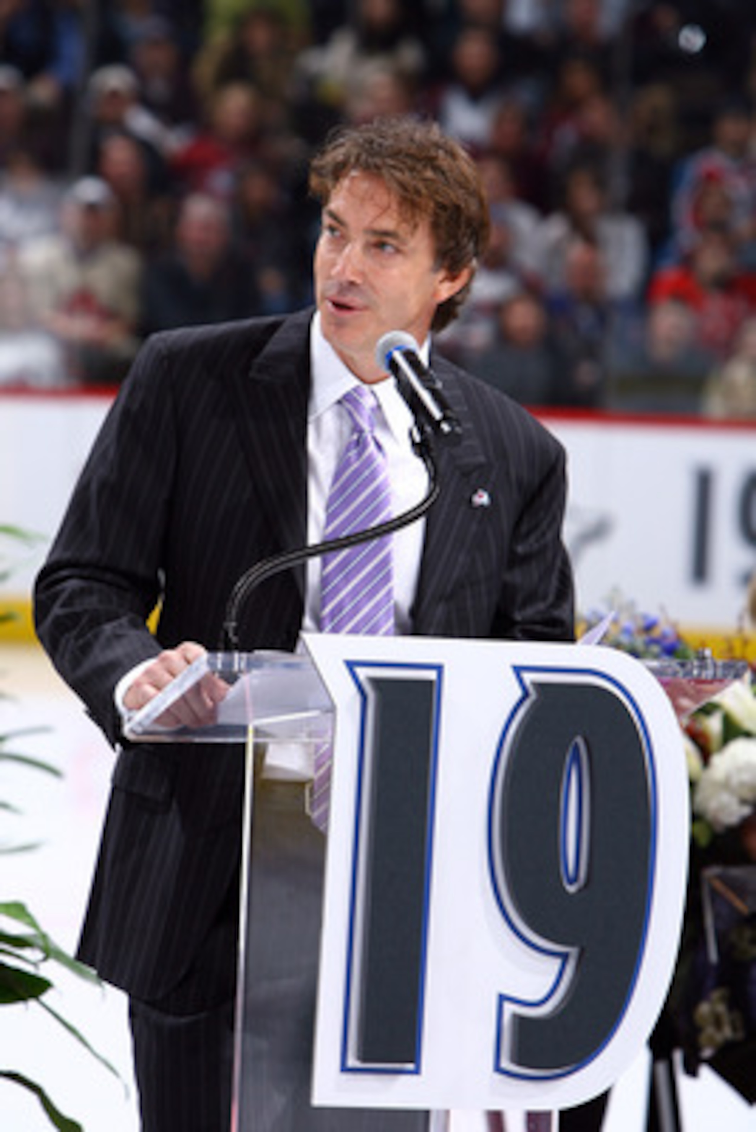 DENVER - OCTOBER 1: Joe Sakic addresses the crowd as his number is retired by the Colorado Avalanche and hoisted to the rafters in a pregame ceremony at the Pepsi Center on October 1, 2009 in Denver, Colorado. NOTE TO USER: User expressly acknowledges and