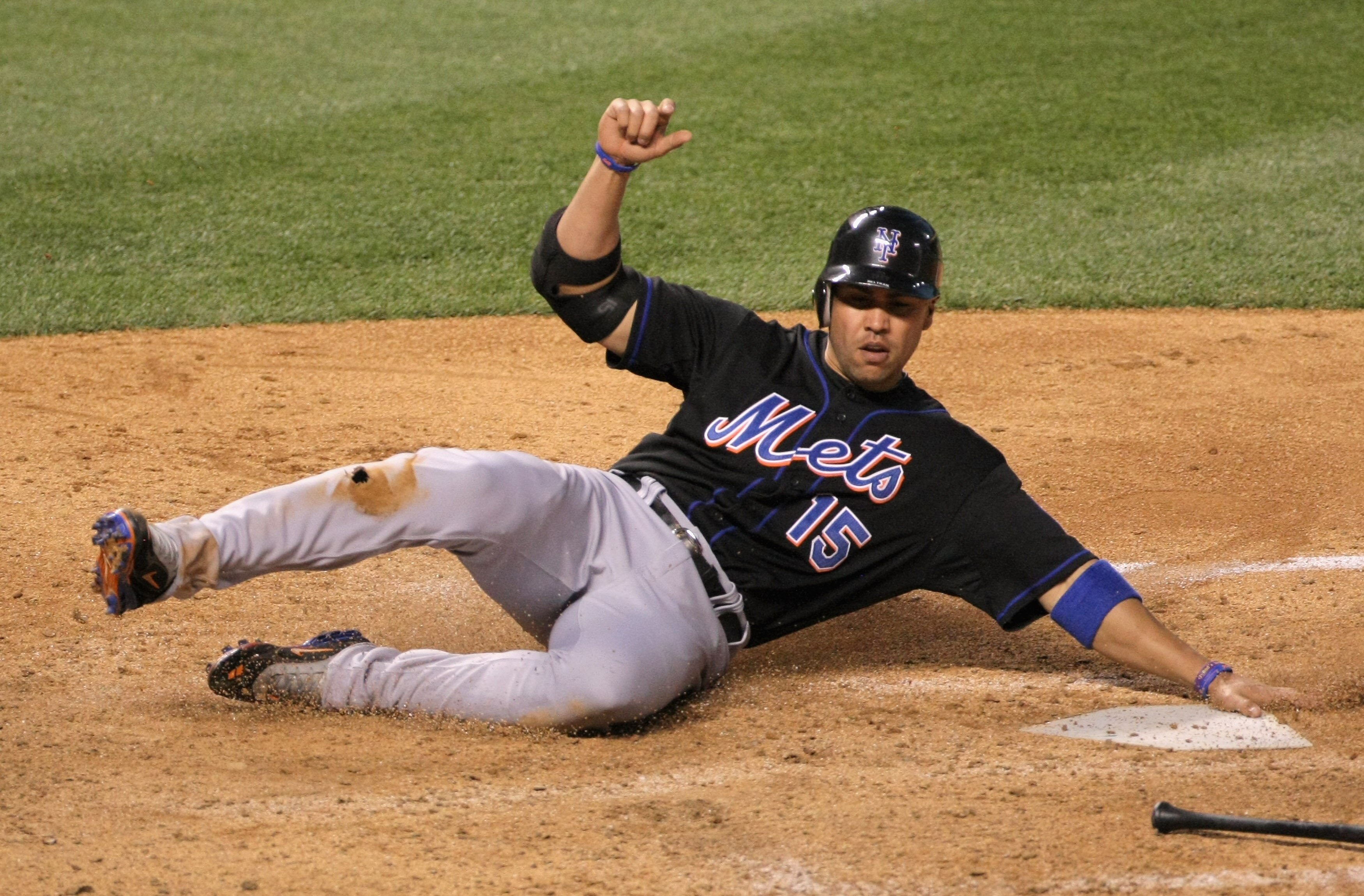 DENVER, CO - MAY 09:  Carlos Beltran #15 of the New York Mets scores on a grounder by Jason Bay #44 of the New York Mets who was safe on the play after a throwing error by third baseman Ian Stewart #9 of the Colorado Rockies in the sixth inning at Coors F
