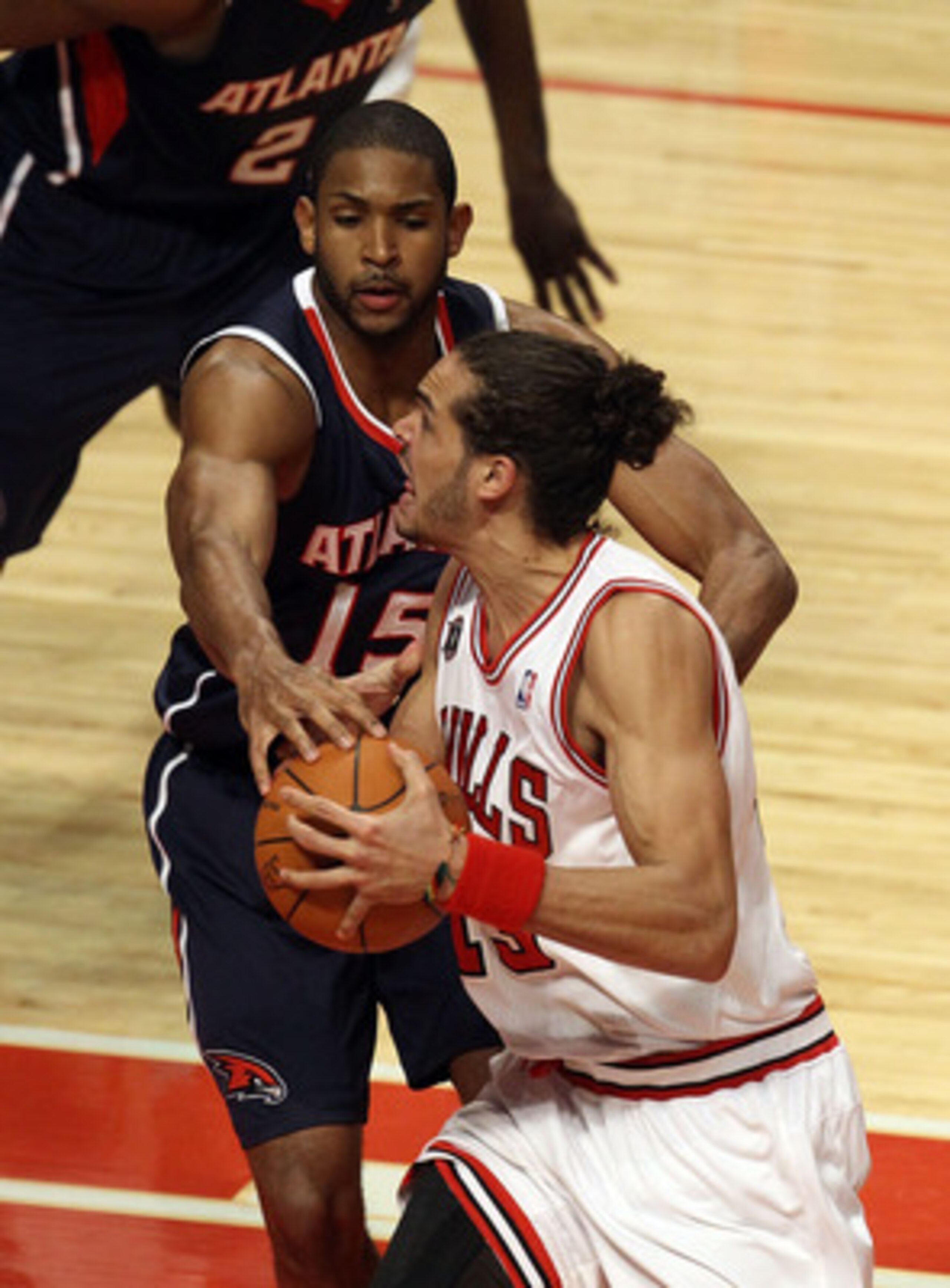 CHICAGO, IL - MARCH 11: Joakim Noah #13 of the Chicago Bulls drives against Al Horford #15 of the Atlanta Hawks at the United Center on March 11, 2011 in Chicago, Illinois. The Bulls defeated the Hawks 94-76. NOTE TO USER: User expressly acknowledges and