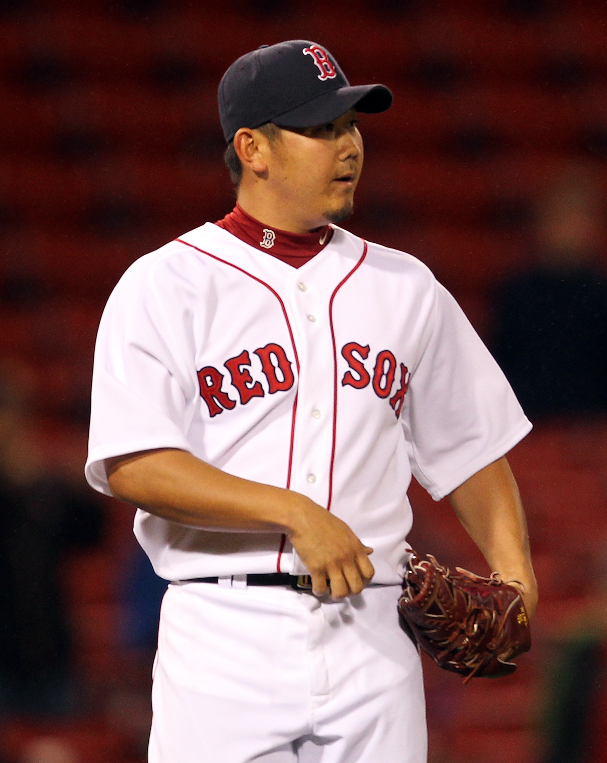 BOSTON, MA - MAY 04:  Daisuke Matsuzaka #18 of the Boston Red Sox reacts after giving up a single to Peter Bourjos #25 of the Los Angeles Angels of Anaheim at Fenway Park on May 4, 2011 in Boston, Massachusetts. (Photo by Jim Rogash/Getty Images)