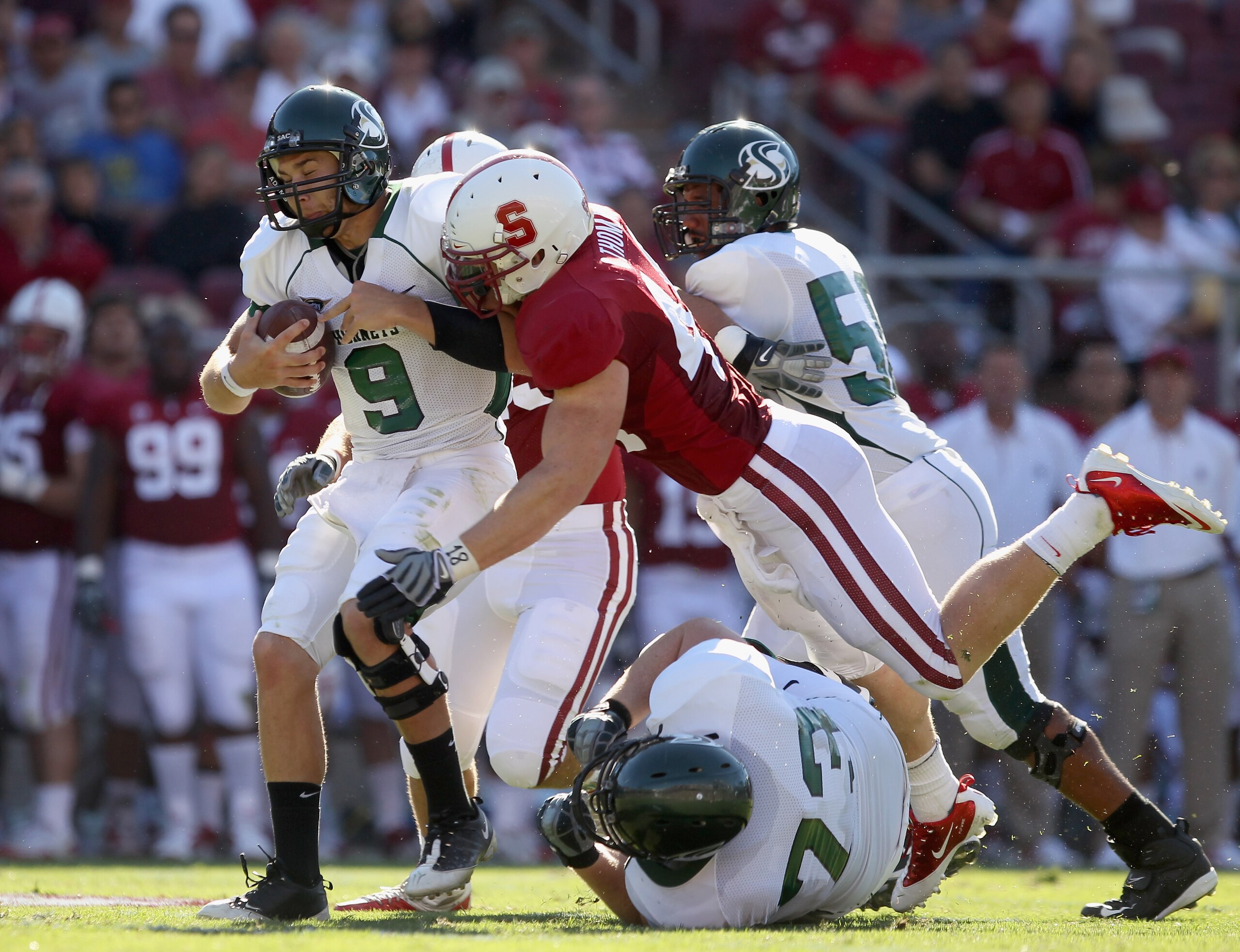 PALO ALTO, CA - SEPTEMBER 04:  McLeod Bethel-Thompson #9 of the Sacramento State Hornets is sacked by Chase Thomas #44 of the Stanford Cardinal at Stanford Stadium on September 4, 2010 in Palo Alto, California.  (Photo by Ezra Shaw/Getty Images)