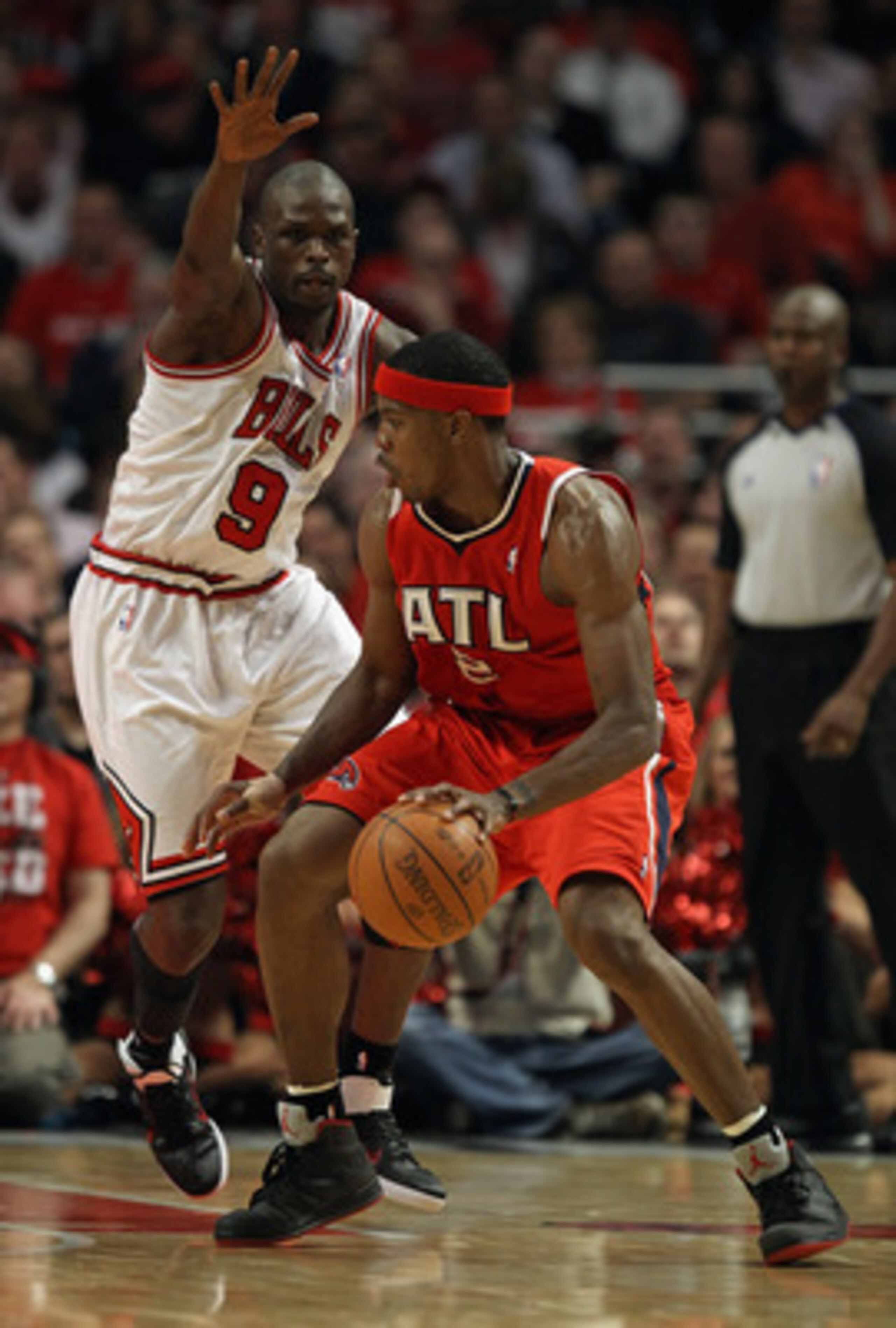 CHICAGO, IL - MAY 04: Joe Johnson #2 of the Atlanta Hawks tries to move against Loul Deng #9 of the Chicago Bulls in Game Two of the Eastern Conference Semifinals in the 2011 NBA Playoffs at the United Center on May 4, 2011 in Chicago, Illinois. The Bulls