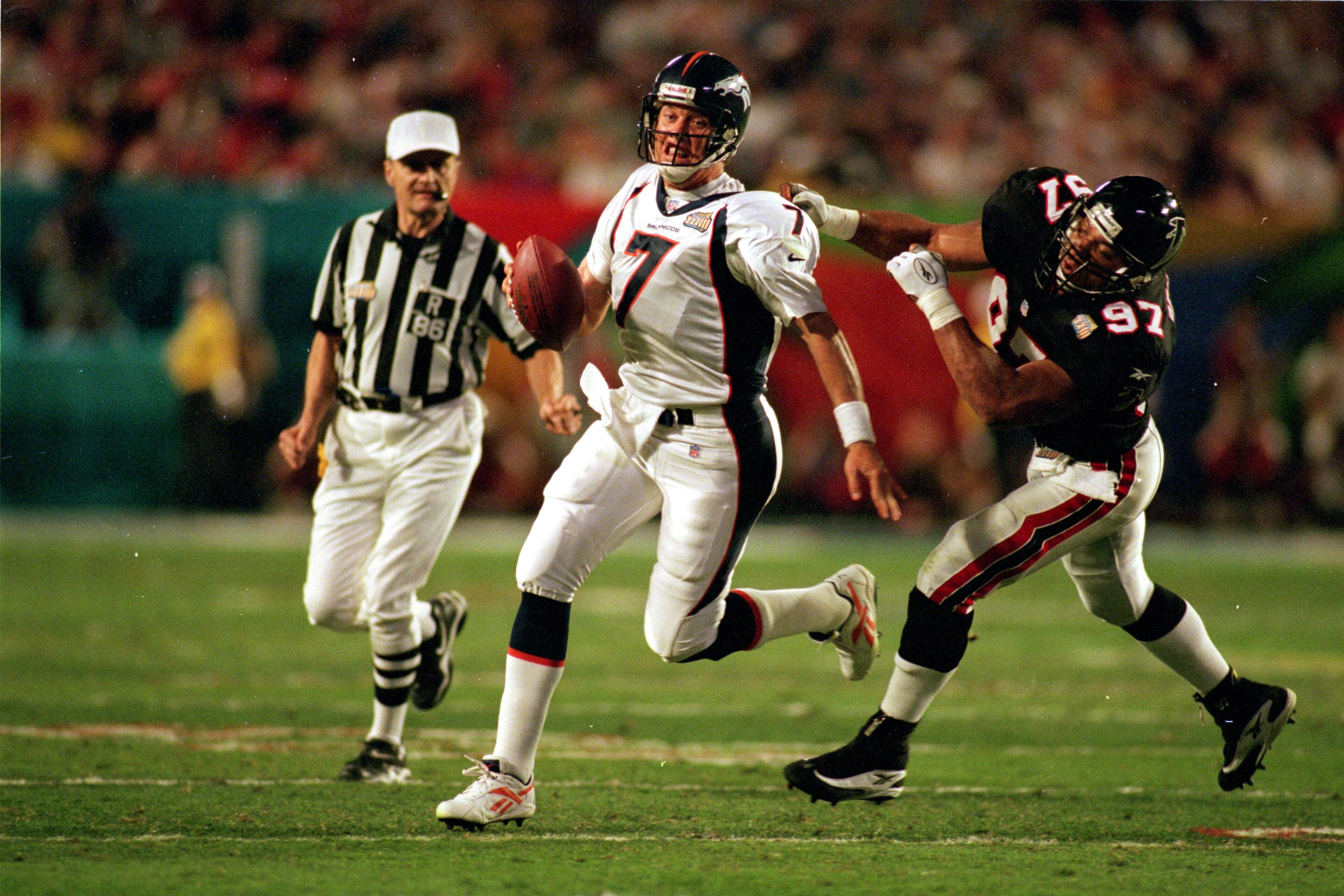 31 Jan 1999: John Elway #7 of the Denver Broncos is sacked by Cornelius Bennett #97 of the Atlanta Falcons during the Superbowl XXXIII at the Pro Player Stadium in Miami, Florida. The Broncos defeated the Falcons 34-19. Mandatory Credit: Al Bello /All 31 Jan 1999: John Elway #7 of the Denver Broncos is sacked by Cornelius Bennett #97 of the Atlanta Falcons during the Superbowl XXXIII at the Pro Player Stadium in Miami, Florida. The Broncos defeated the Falcons 34-19. Mandatory Credit: Al Bello /All