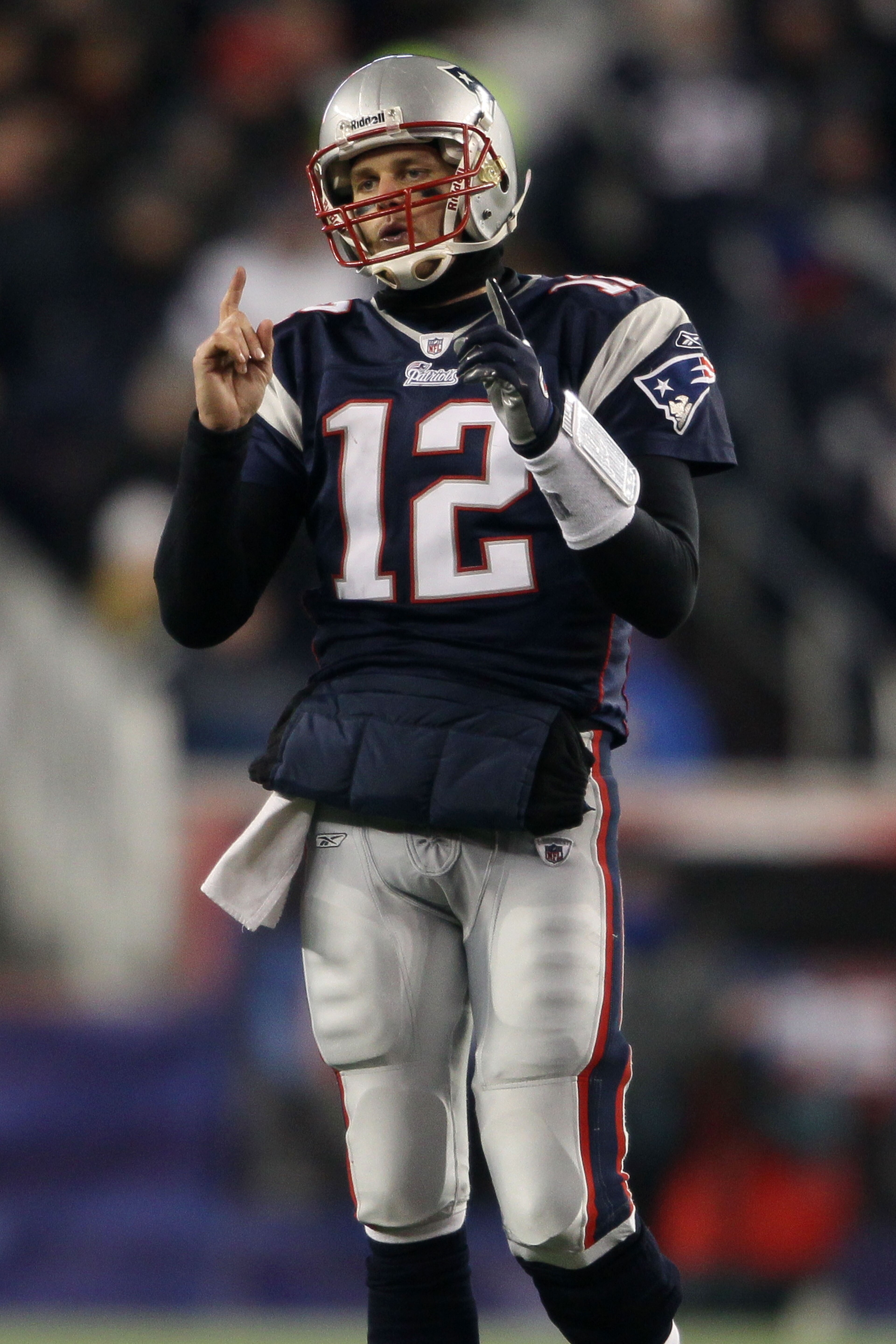 FOXBORO, MA - JANUARY 16: Quarterback Tom Brady #12 of the New England Patriots signals during their 2011 AFC divisional playoff game against the New York Jets at Gillette Stadium on January 16, 2011 in Foxboro, Massachusetts. (Photo by Elsa/Getty Image FOXBORO, MA - JANUARY 16: Quarterback Tom Brady #12 of the New England Patriots signals during their 2011 AFC divisional playoff game against the New York Jets at Gillette Stadium on January 16, 2011 in Foxboro, Massachusetts. (Photo by Elsa/Getty Image