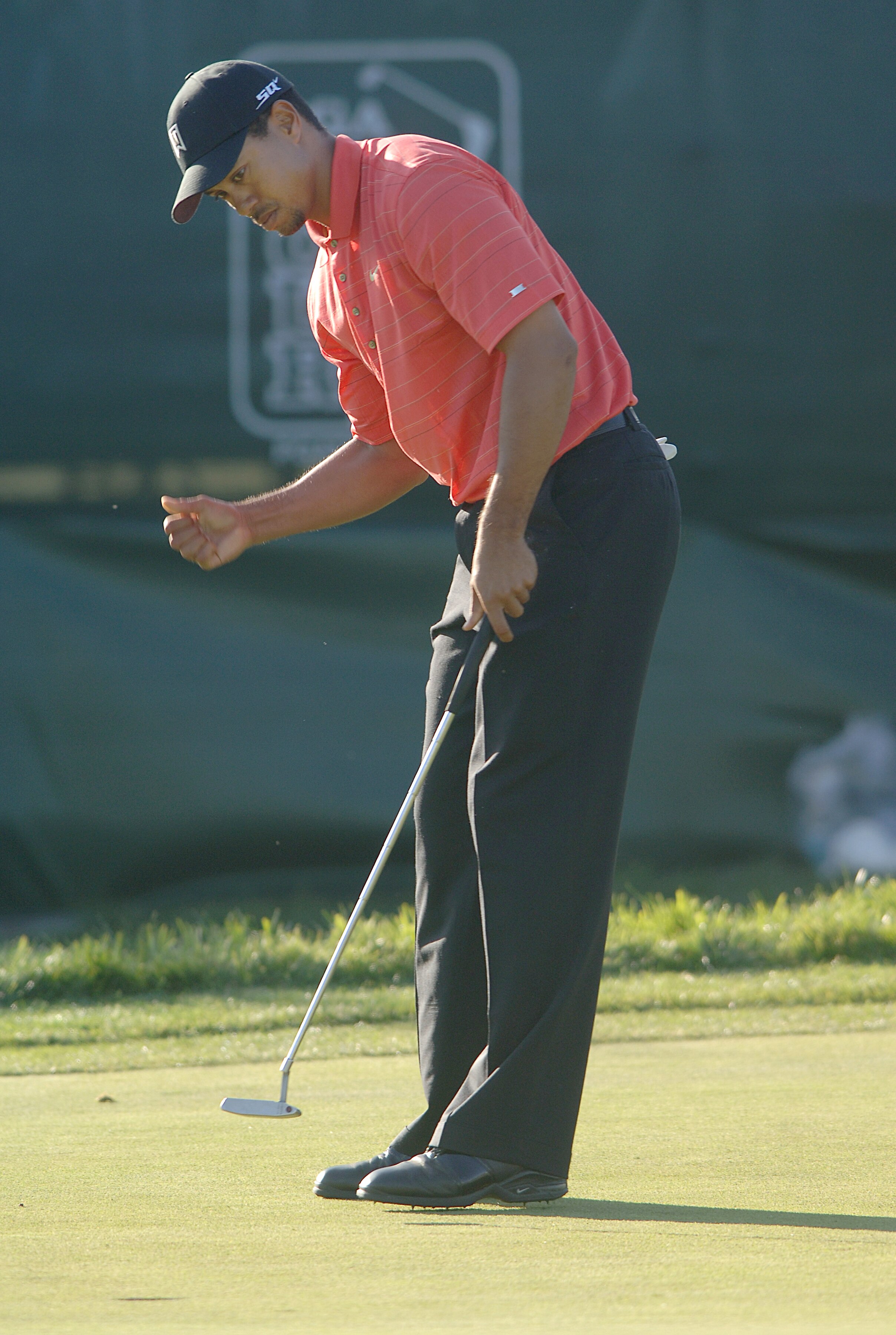 UNITED STATES - JANUARY 29: Tiger Woods reacts to a made putt on the 18th green during the final round of the PGA TOUR's 2006 Buick Invitational at Torrey Pines South in La Jolla, California January 29, 2006. (Photo by Steve Grayson/Getty Images) UNITED STATES - JANUARY 29: Tiger Woods reacts to a made putt on the 18th green during the final round of the PGA TOUR's 2006 Buick Invitational at Torrey Pines South in La Jolla, California January 29, 2006. (Photo by Steve Grayson/Getty Images)